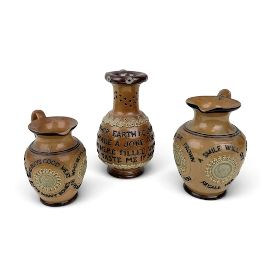 A DOULTON LAMBETH SALT-GLAZED STONEWARE PUZZLE JUG, CIRCA 19...