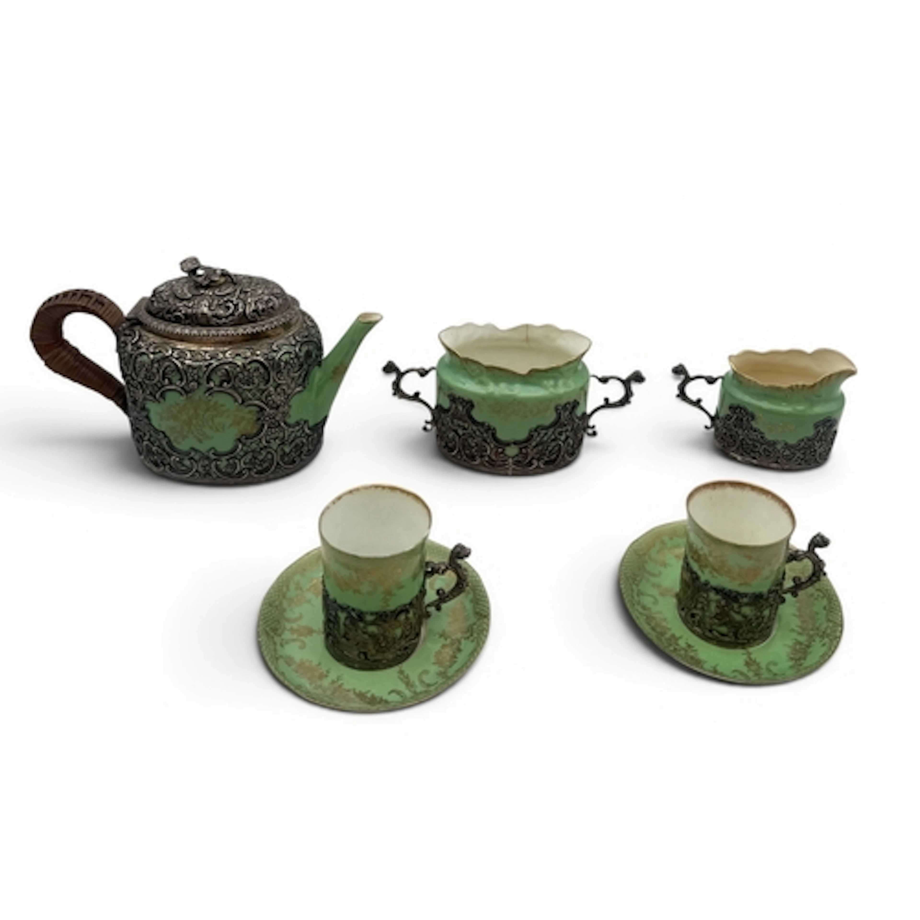 A SILVER MOUNTED PORCELAIN STAFFORDSHIRE CHINA TEA SET The g...