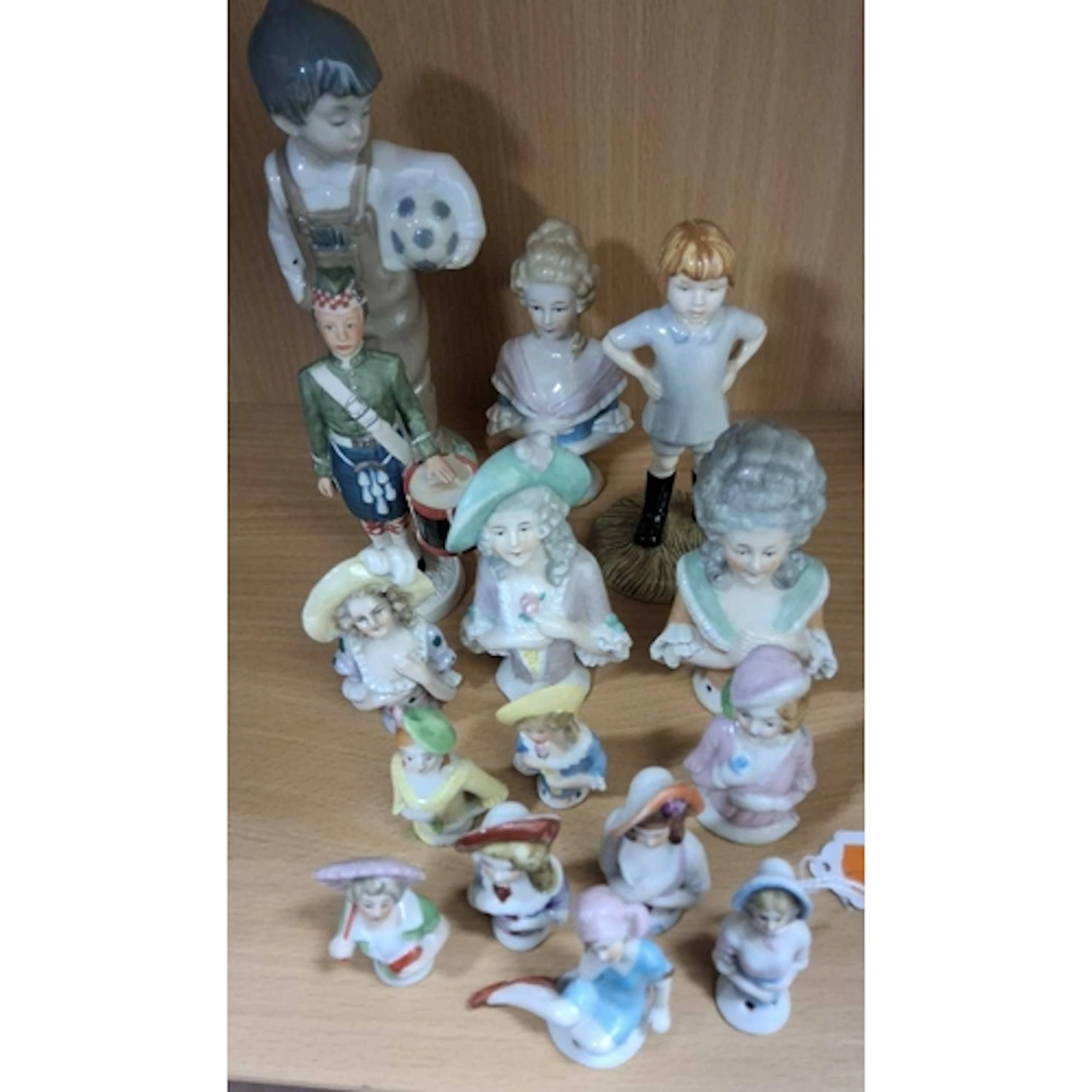 A GROUP OF HALF DOLLS AND OTHER CERAMIC FIGURES, comprising ...
