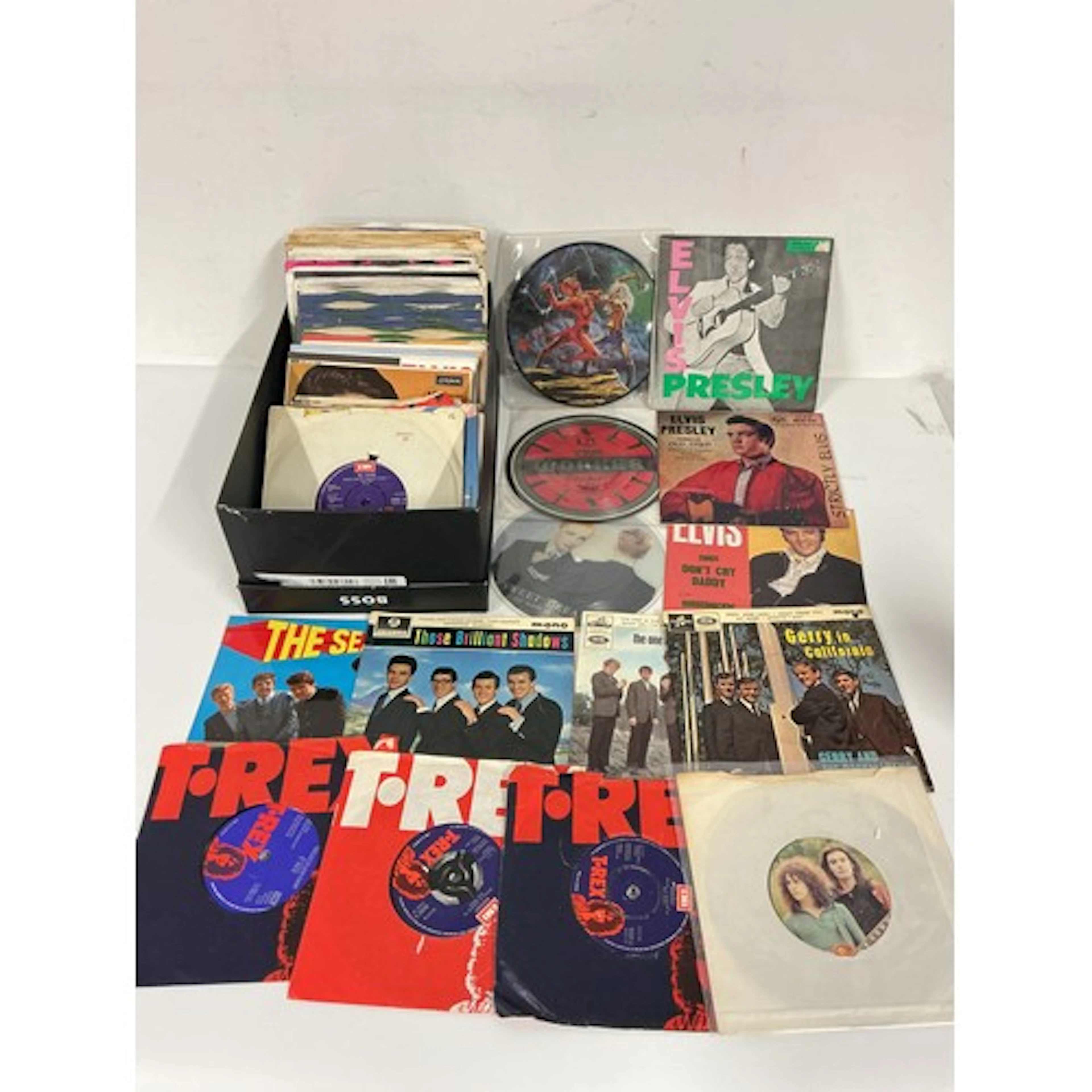 A collection of 7” singles and EPs by various artists includ...