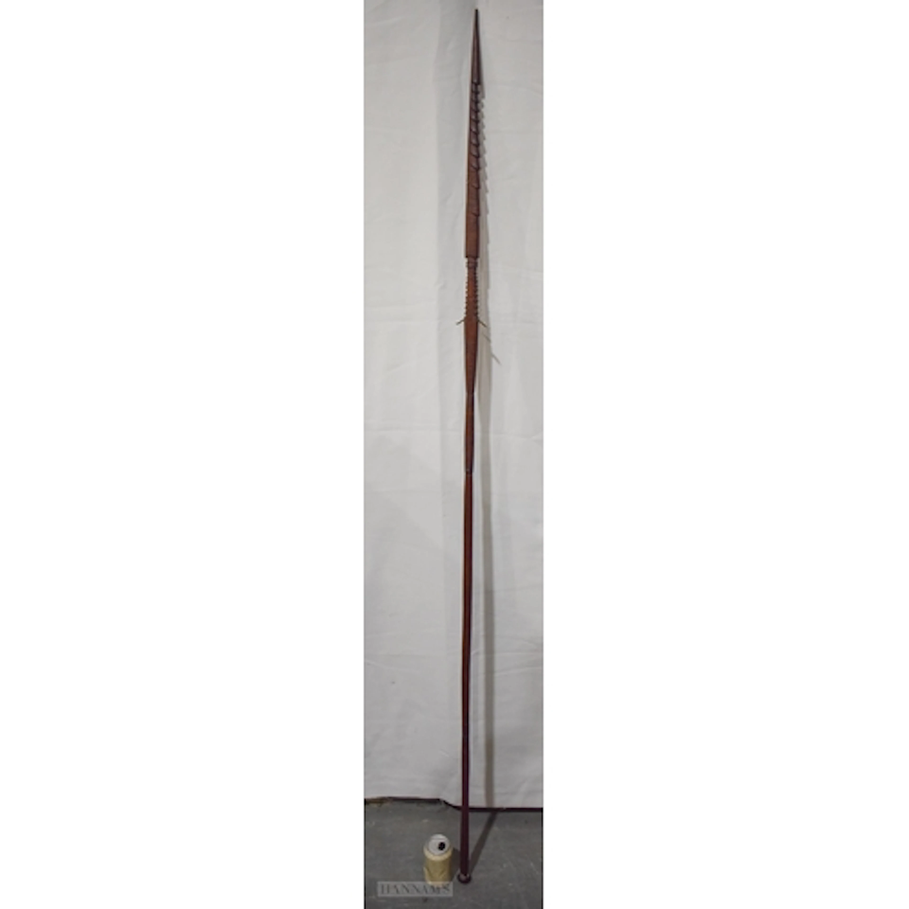 A LARGE ANTIQUE TRIBAL CARVED BARBED SPEAR decorated all ove...