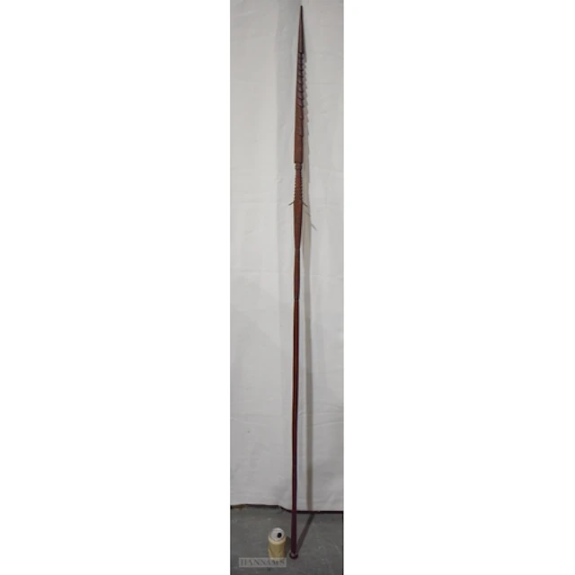 A LARGE ANTIQUE TRIBAL CARVED BARBED SPEAR decorated all ove...