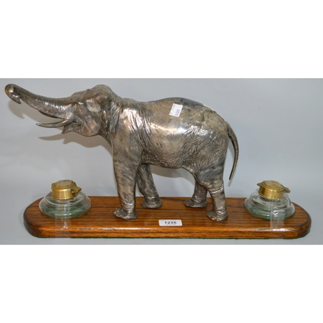 20th Century double inkwell desk stand, mounted with a figur...