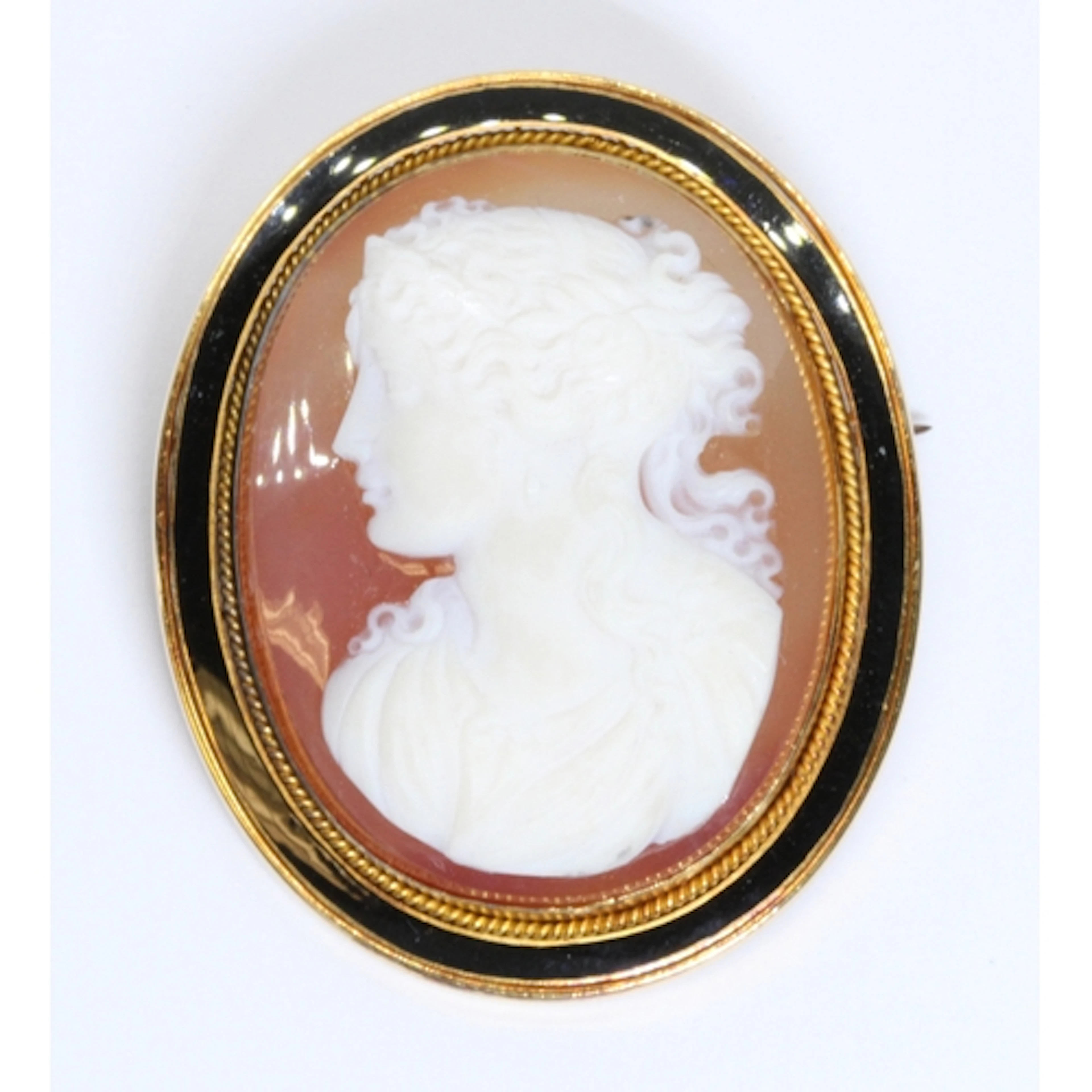 A Victorian sardonyx cameo brooch, finely carved with a Pre-...