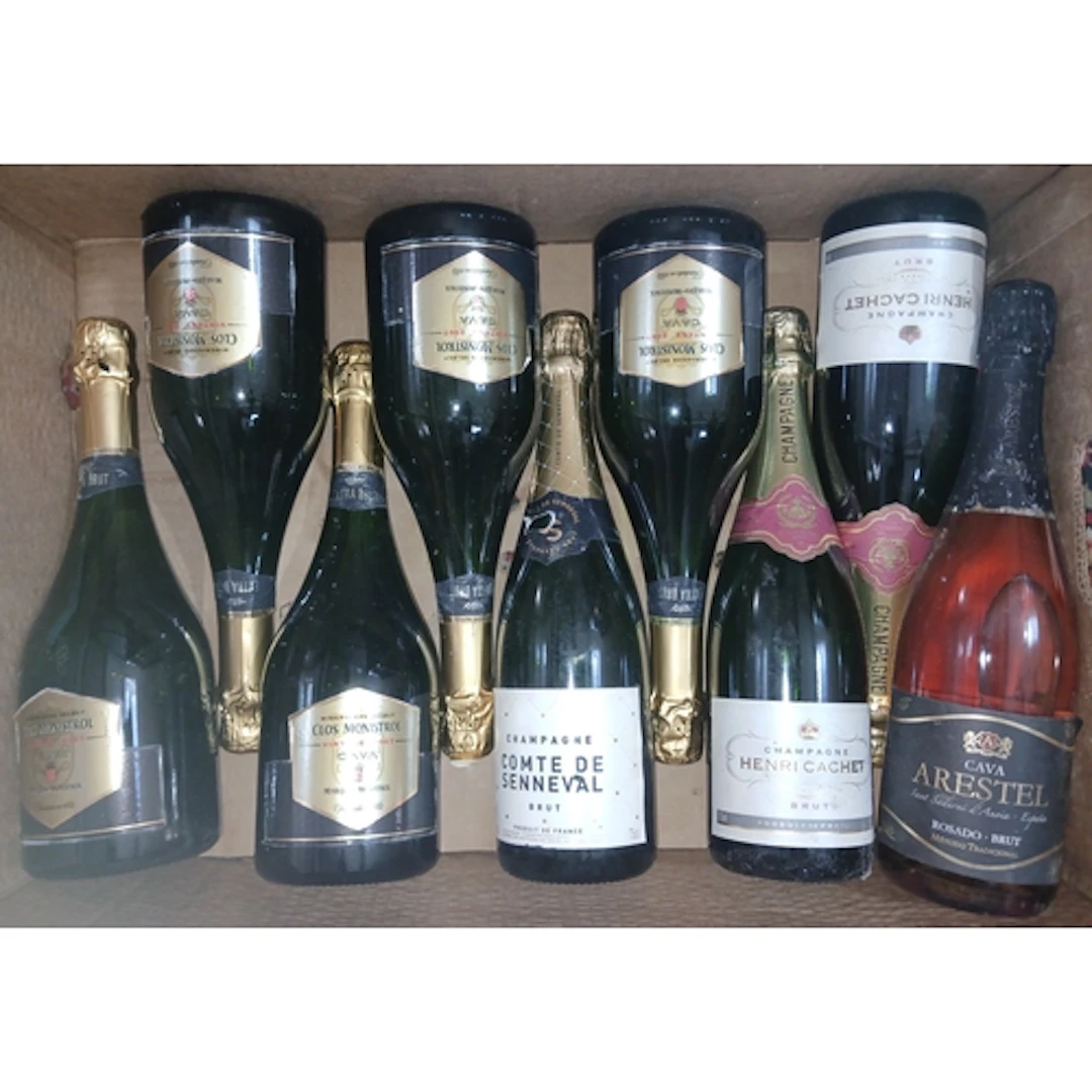 Nine bottles of assorted sparkling wine.