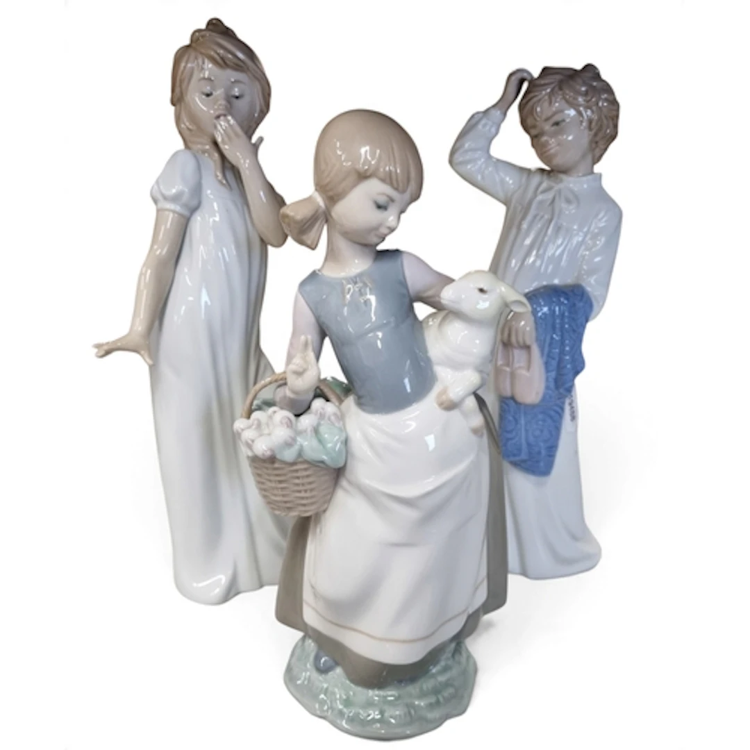 A group of Lladro & Nao Figures.