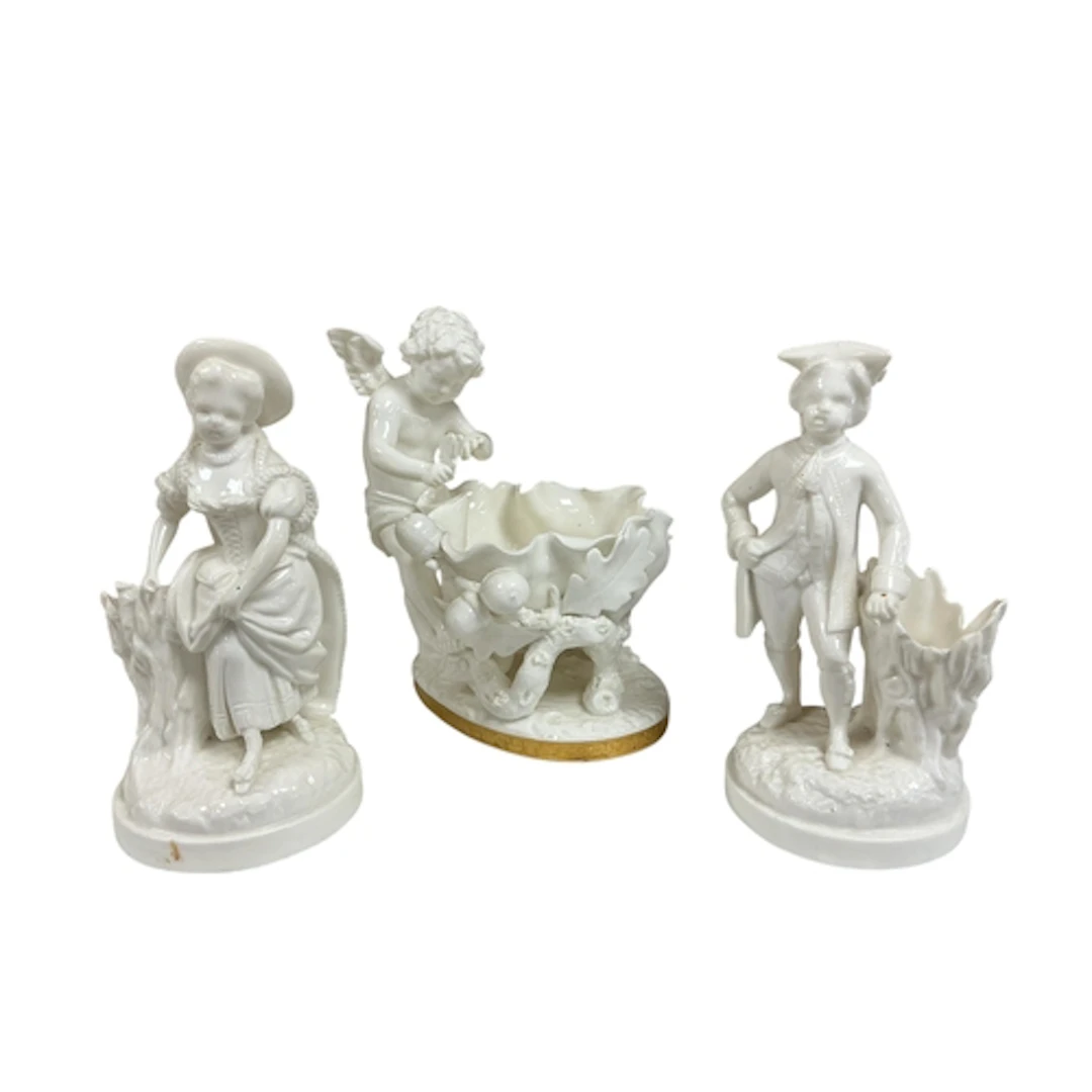 A Victorian Moore Brothers porcelain cherub and acorn basket...