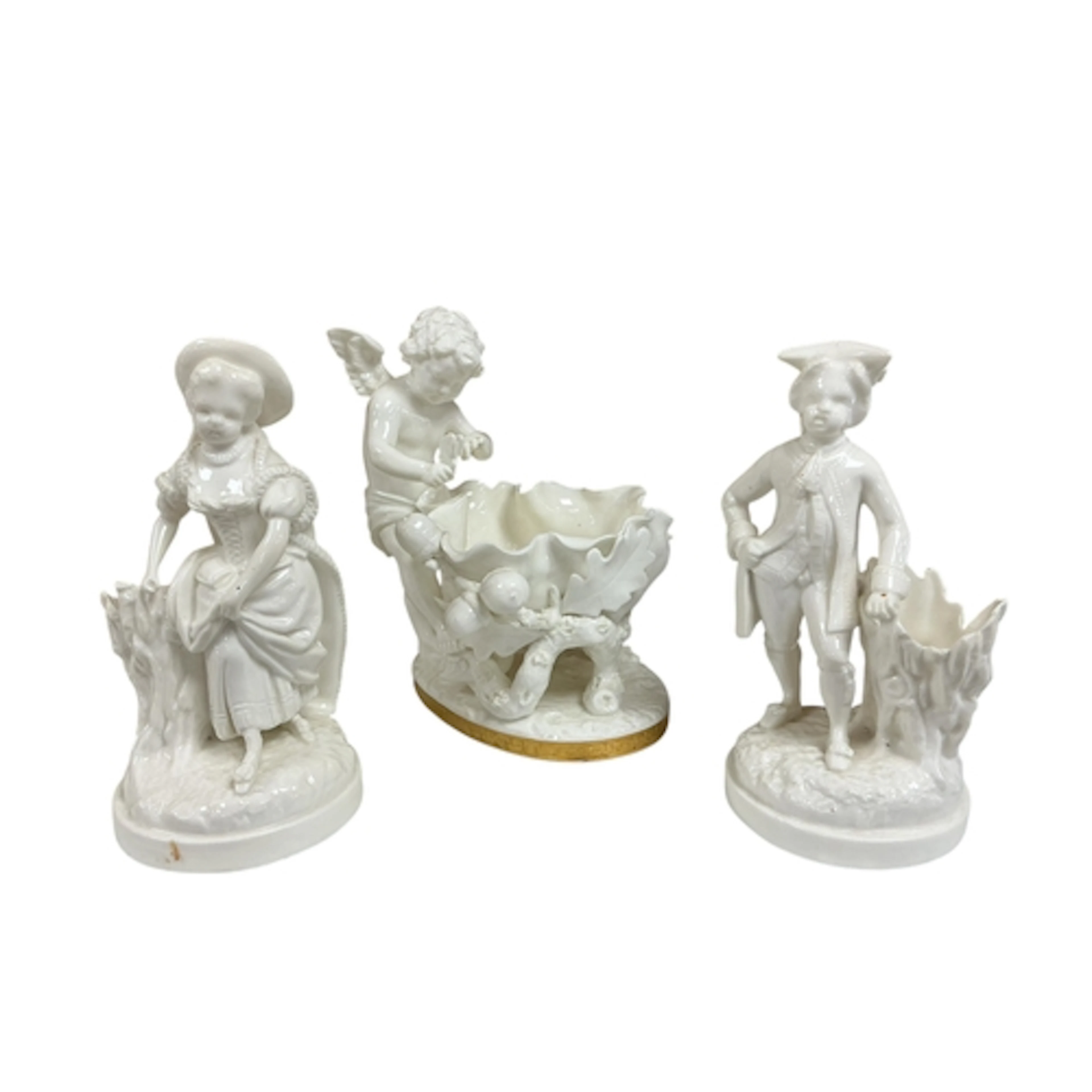 A Victorian Moore Brothers porcelain cherub and acorn basket...