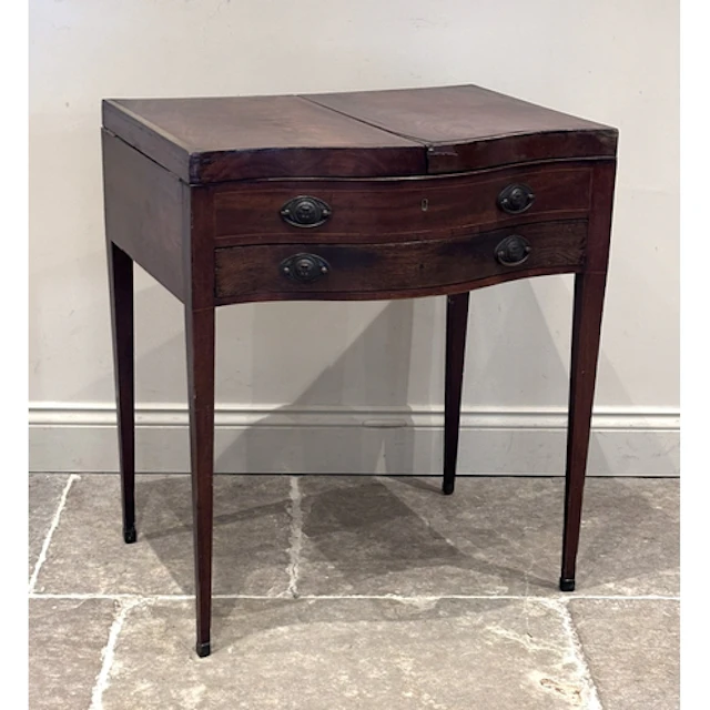 A Regency mahogany envelope top dressing table or vanity sta...