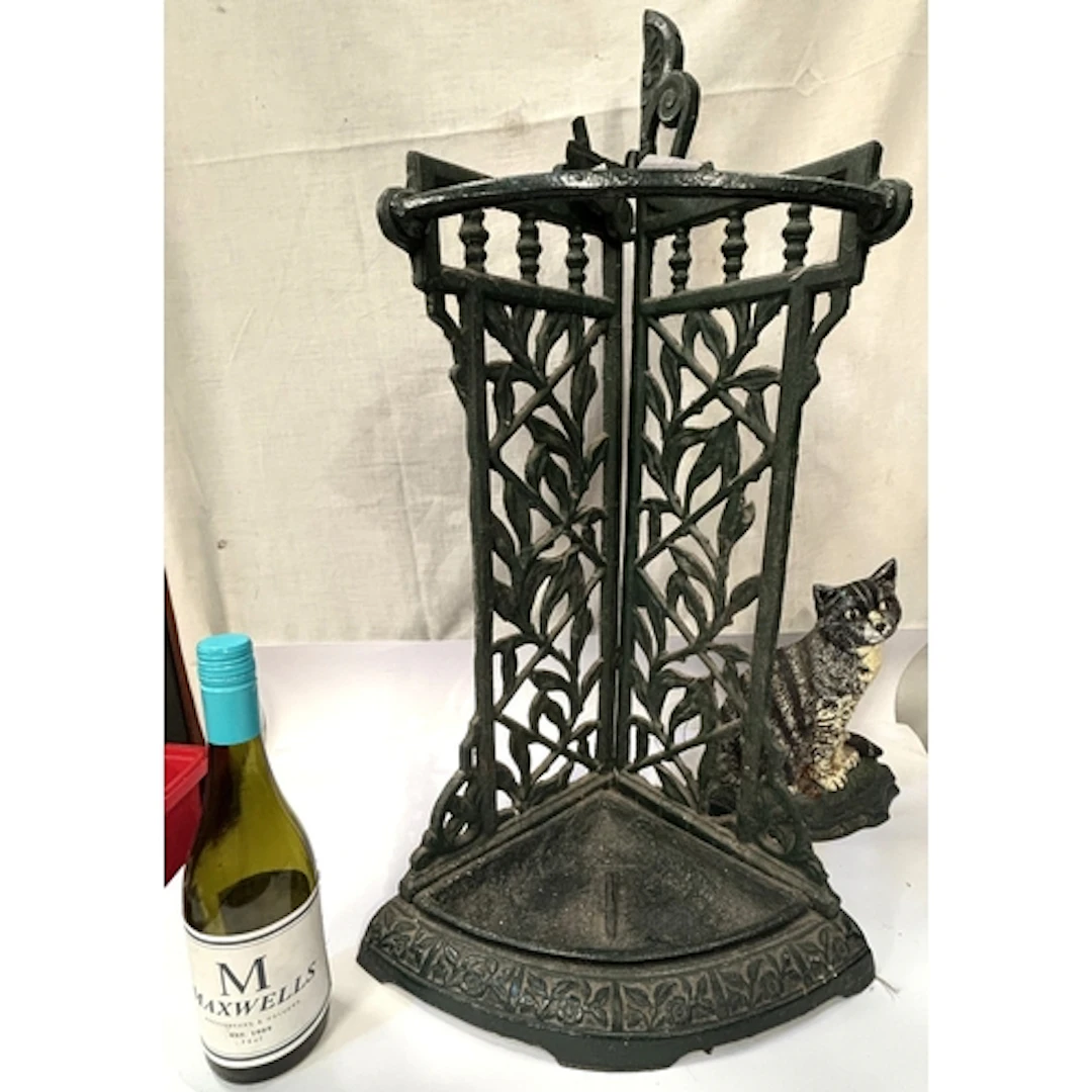 A Coalbrookdale style cast iron green painted stick/umbrella...