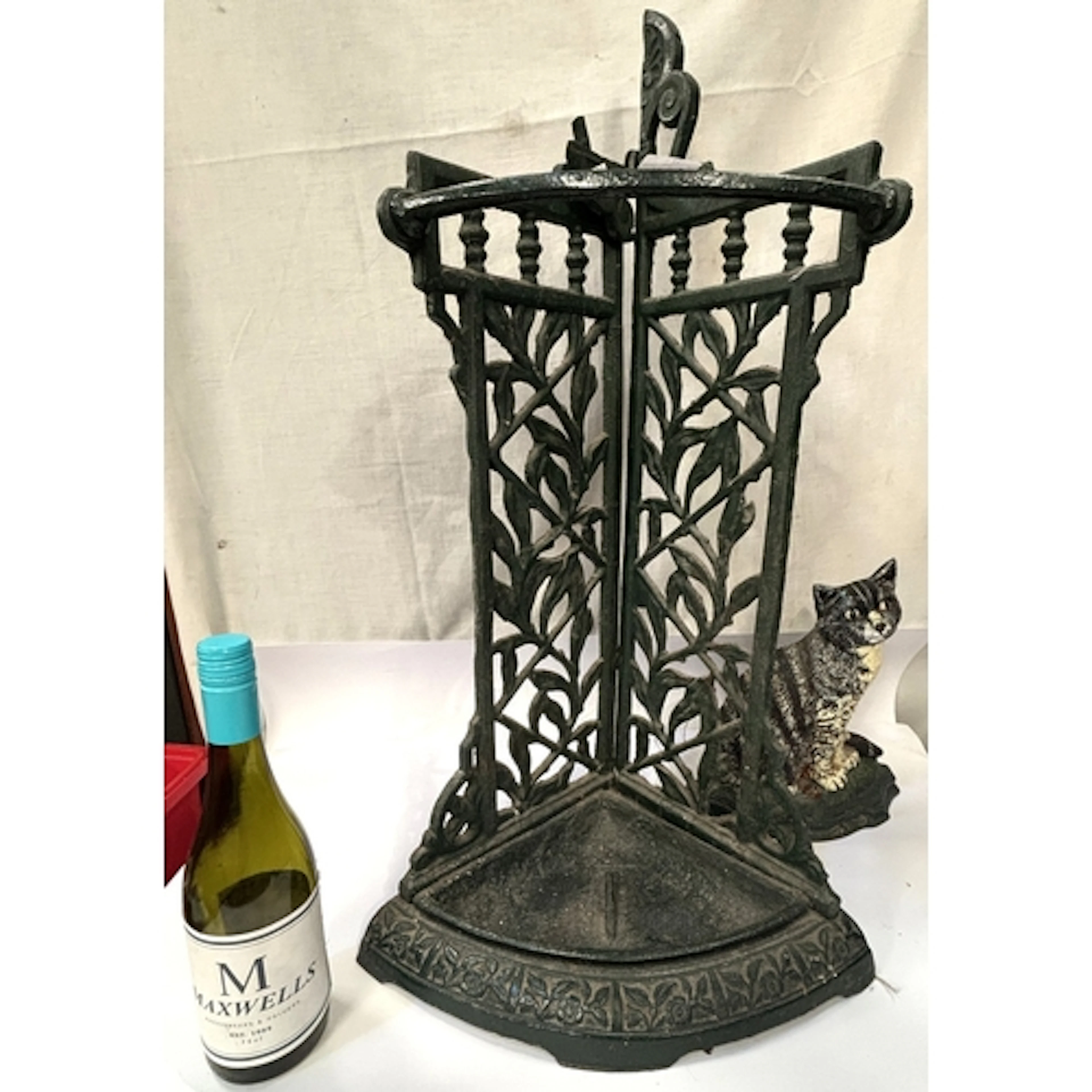 A Coalbrookdale style cast iron green painted stick/umbrella...