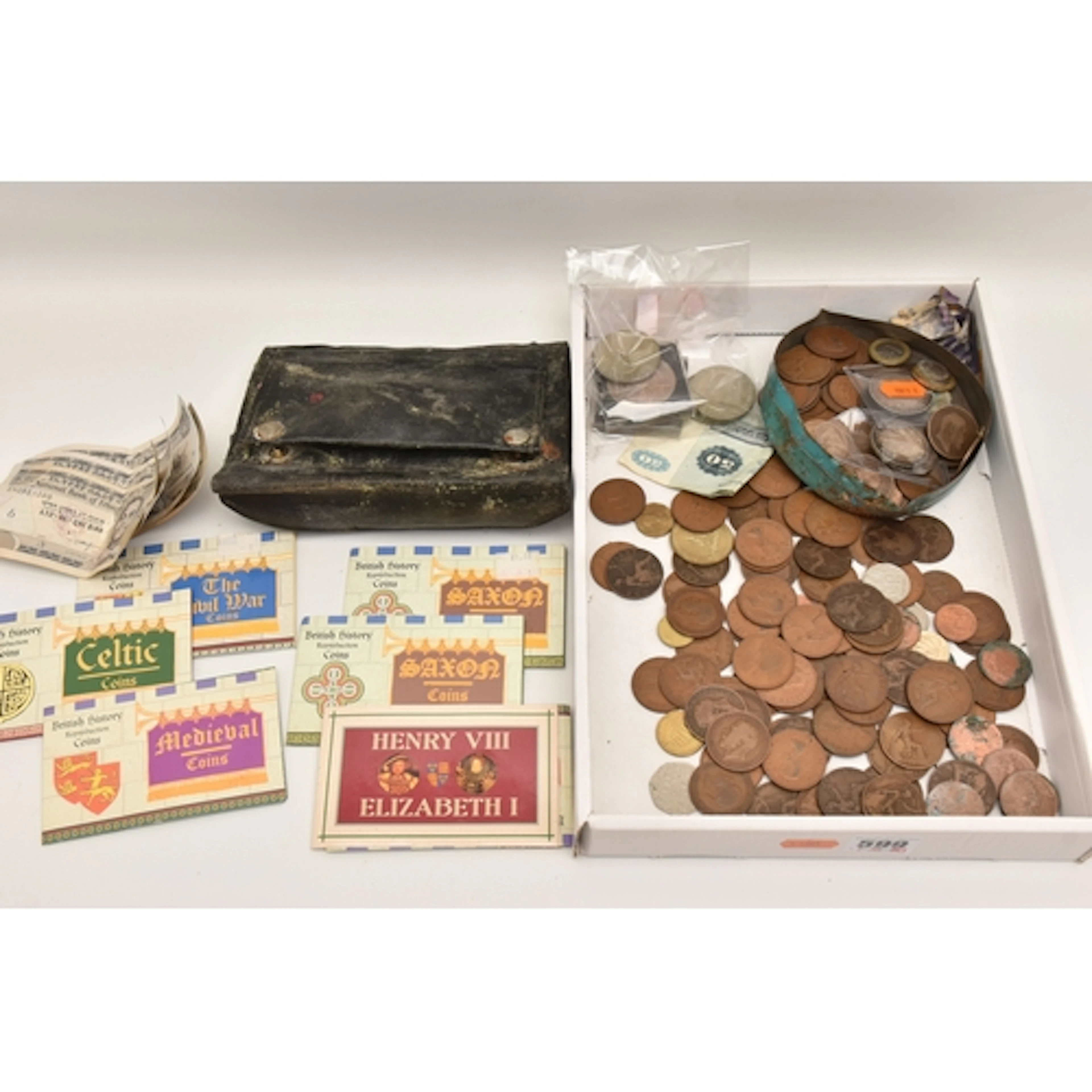 A CARDBOARD TRAY CONTAINING MIXED COINS AND BANKNOTES, to in...