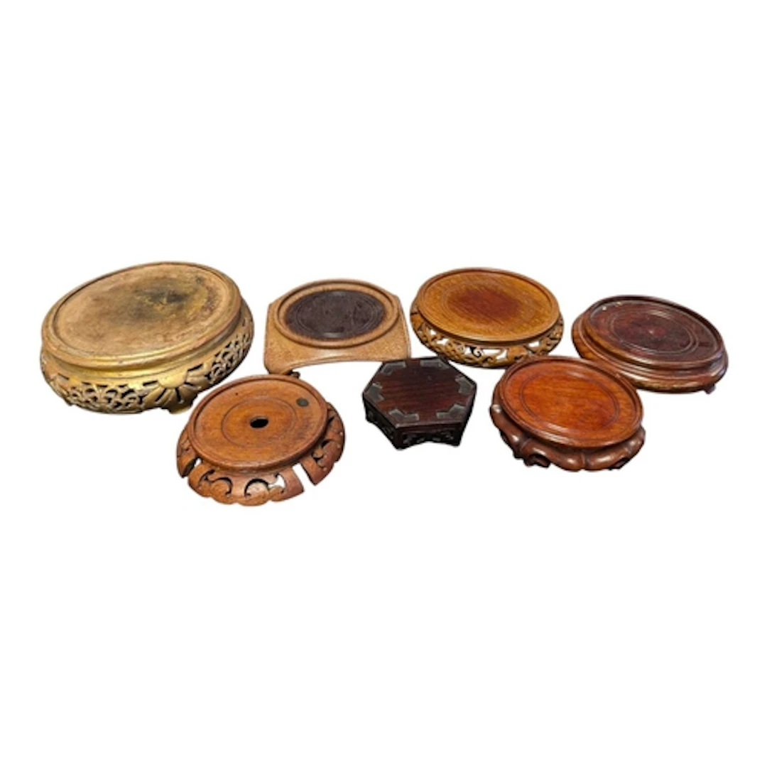 A collection of various Chinese and Japanese carved wooden s...