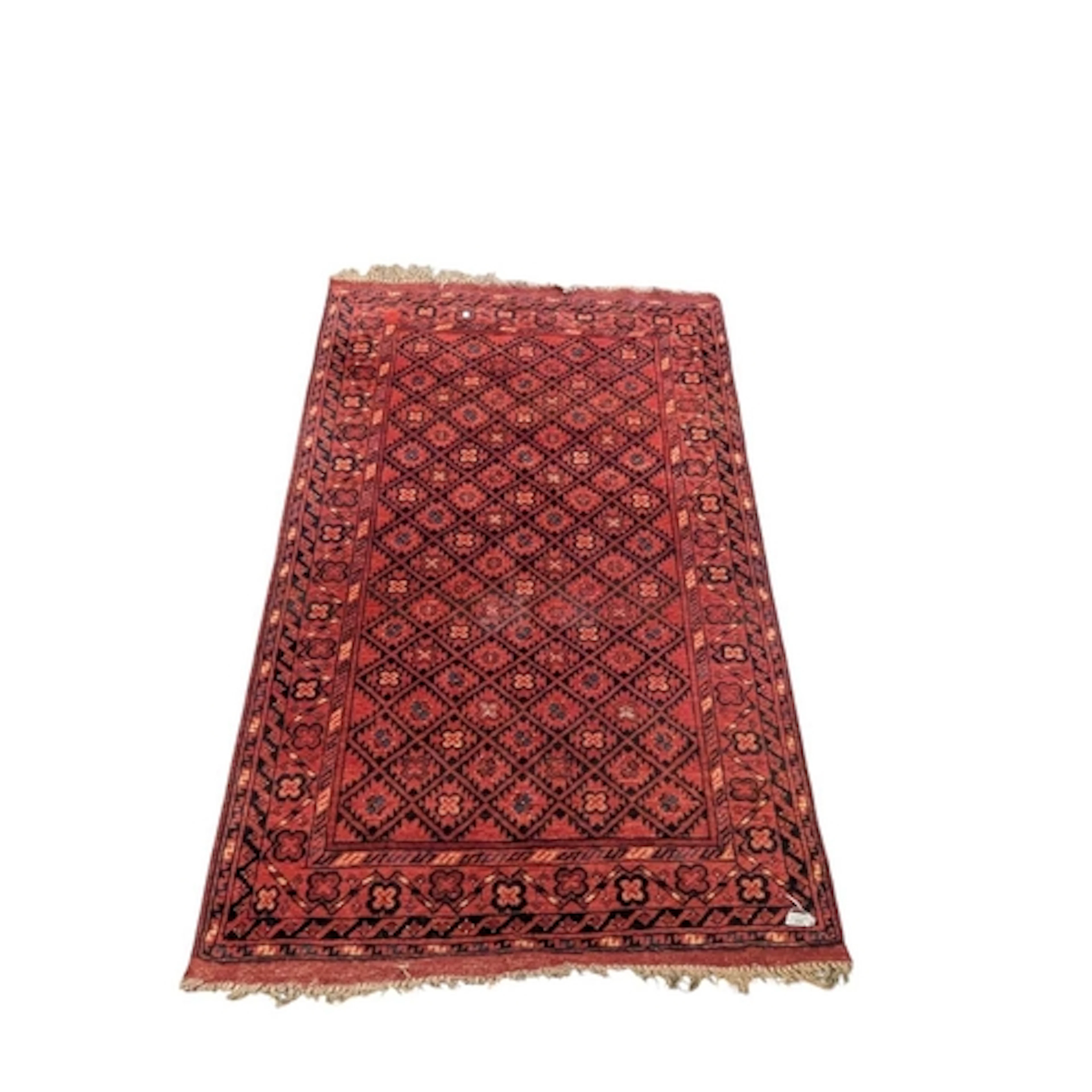 An early 20th century Afghan style carpet rug. The carpet ha...