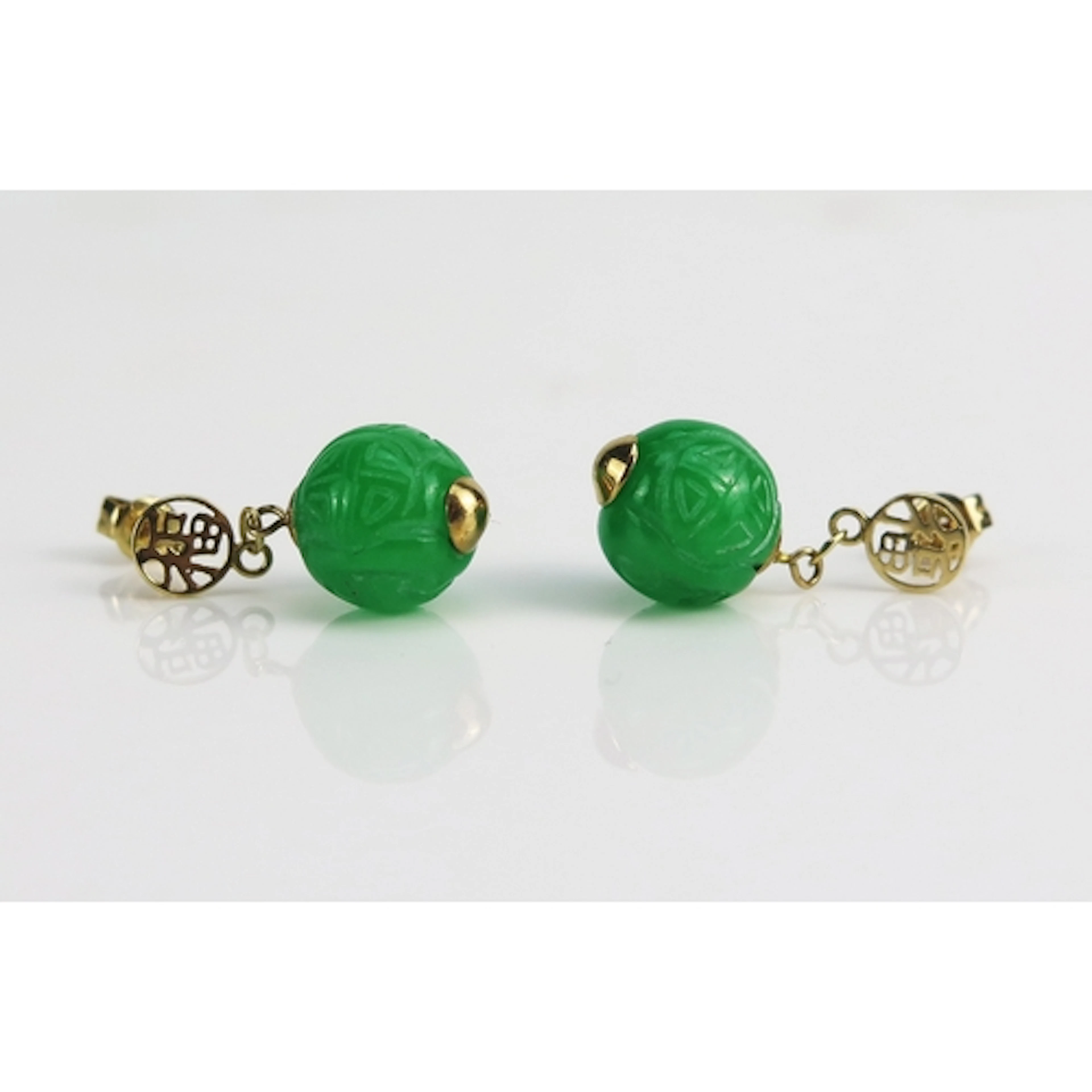 A pair of Chinese carved jade drop earrings in 14K yellow go...