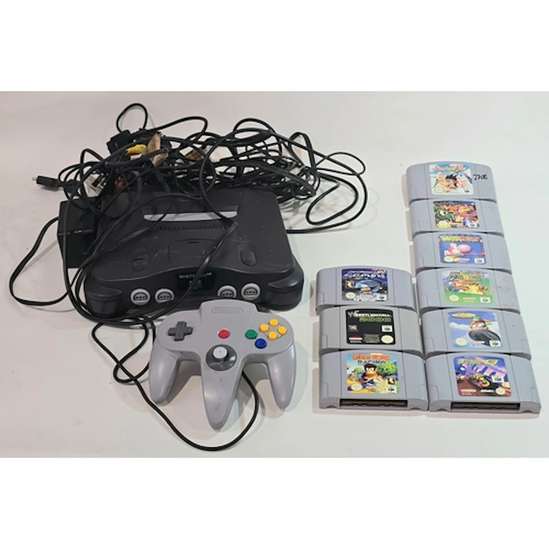 A vintage unboxed Nintendo 64 games console c/w leads and a ...