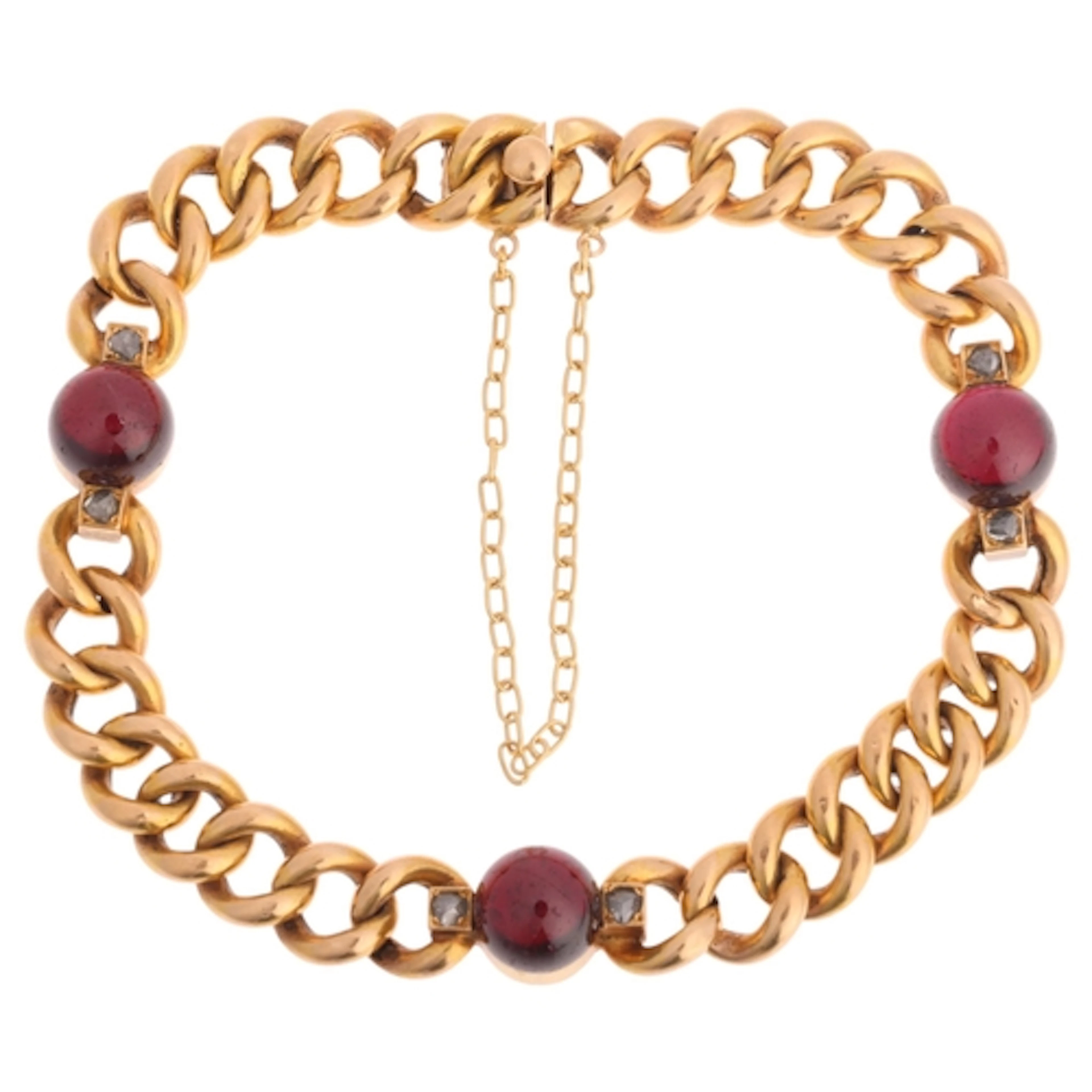 An Antique French 18ct gold garnet and diamond curb link bra...