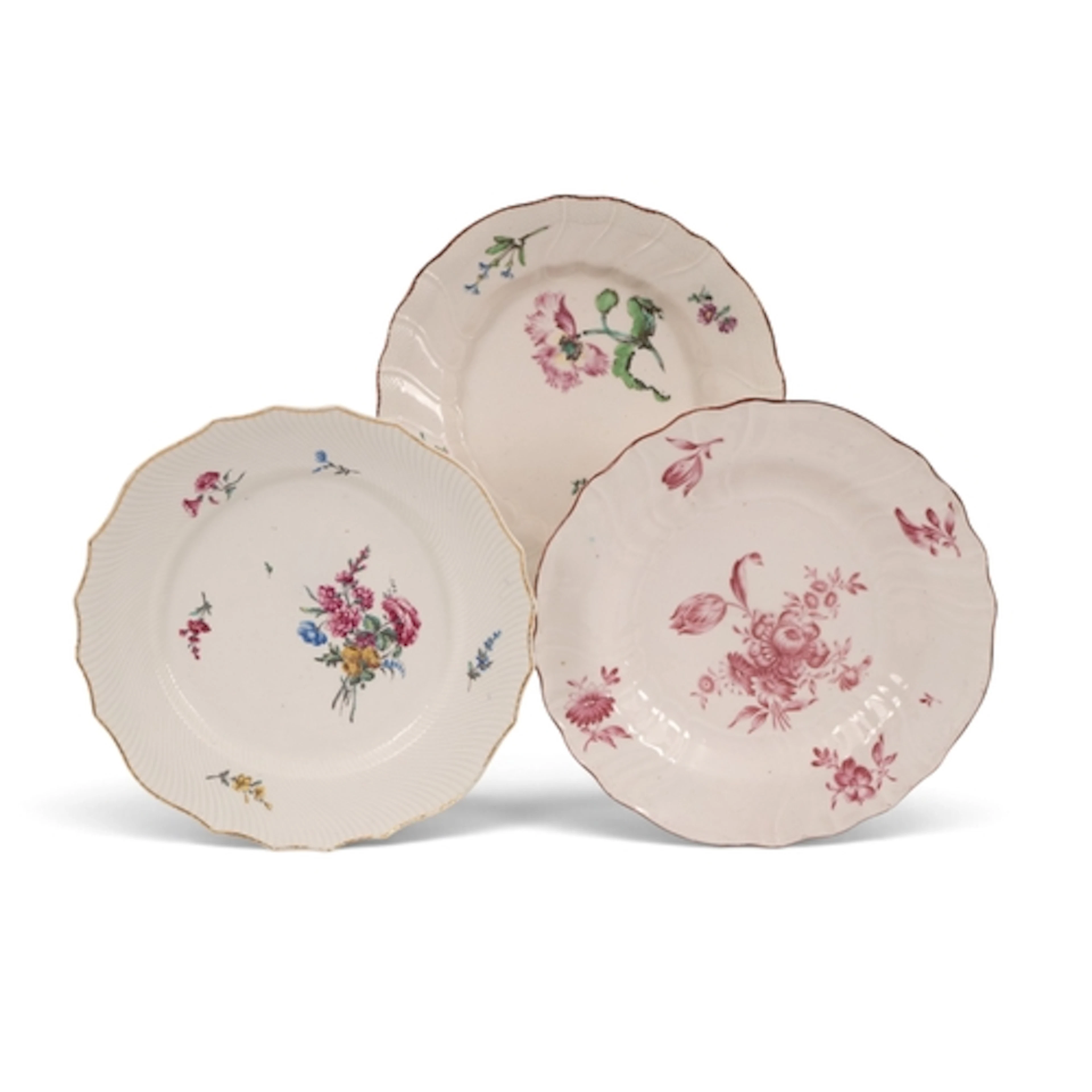 Three Tournai plates, c.1755-70, one early and painted with ...