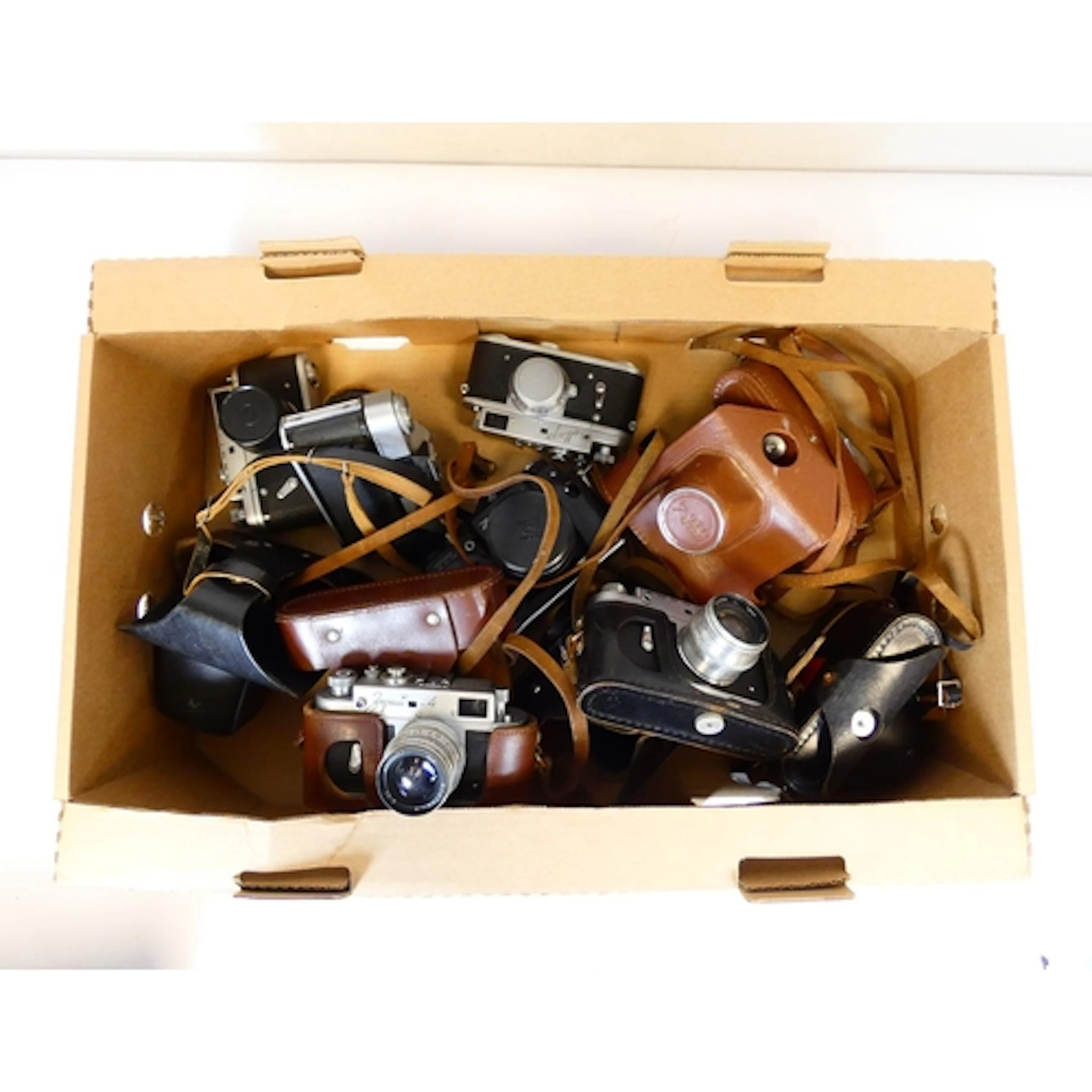 A box of USSR made 35mm film cameras to include Zorki-4, an ...