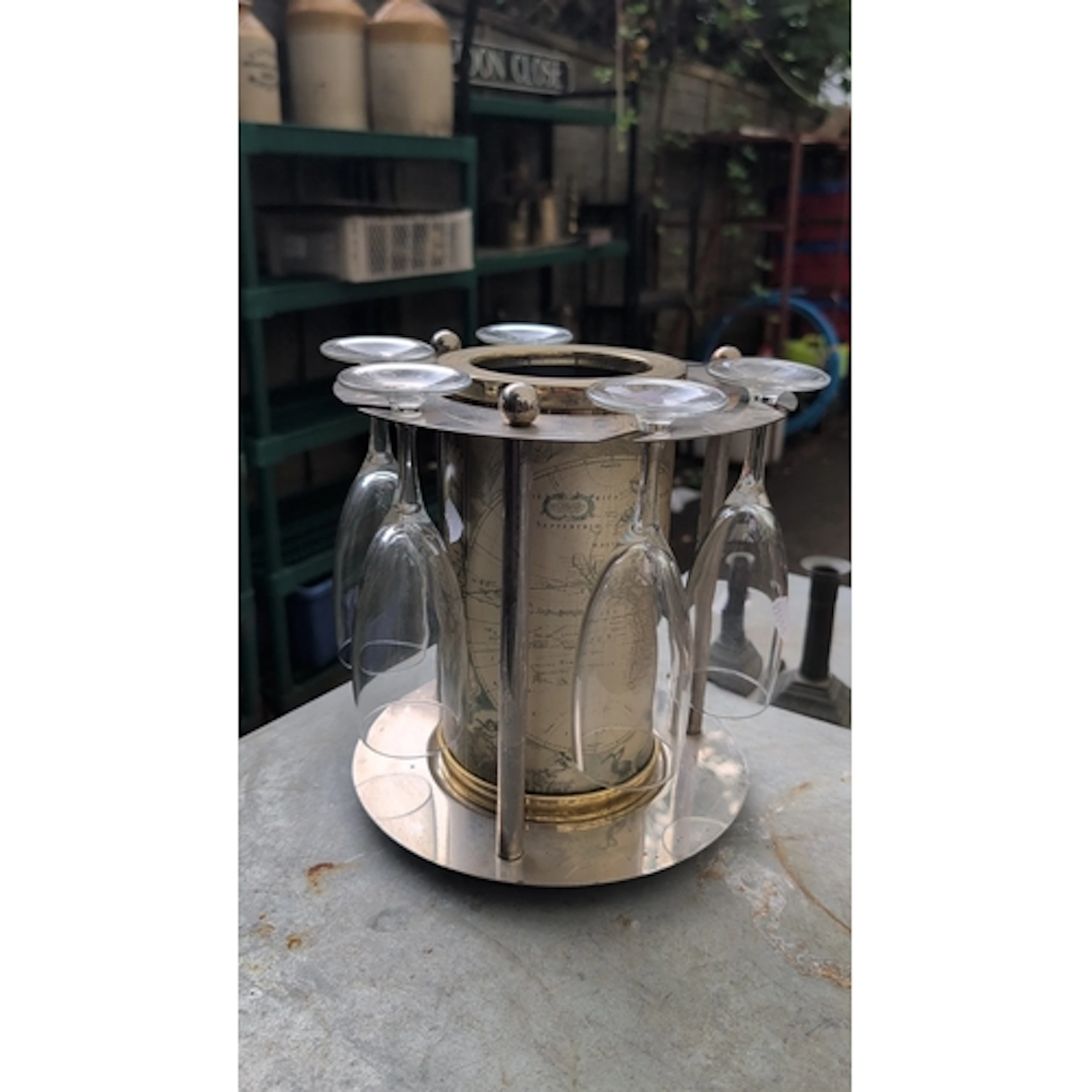 Modern chrome-plated metal bottle coaster or wine caddy, the...