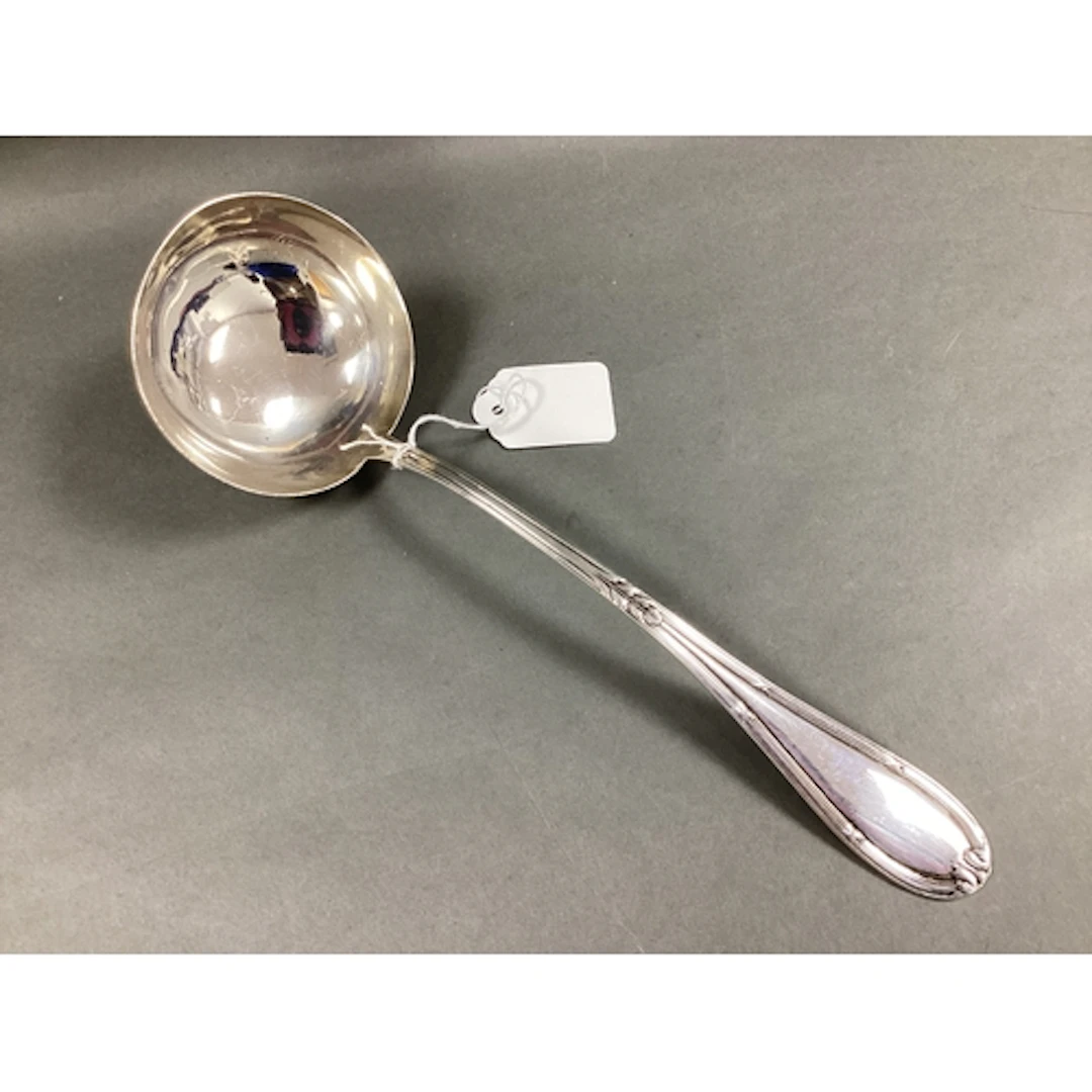 A Spanish Ladle, with decorative handle and circular bowl, i...