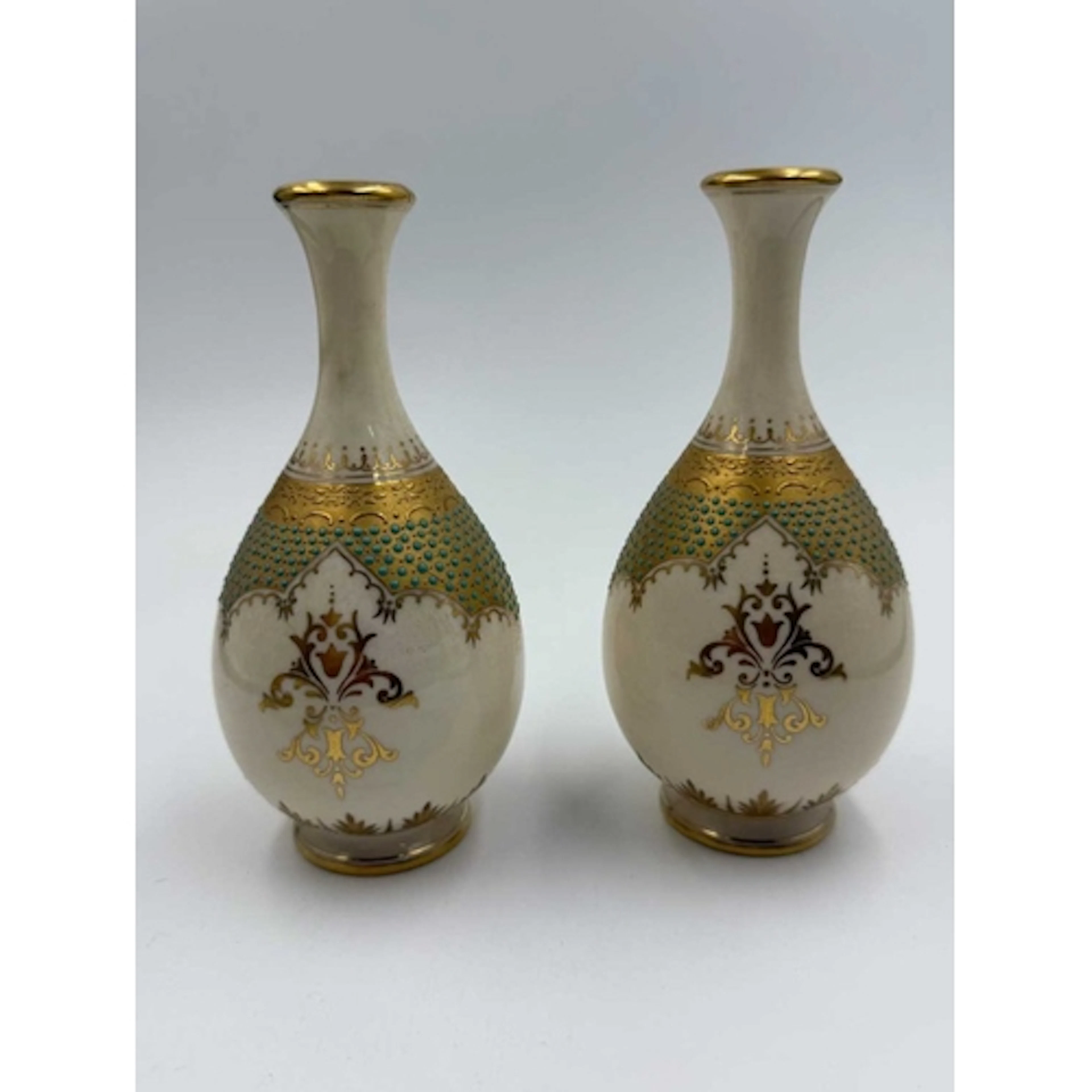 A pair of Coalport vases painted with landscape panels of Lo...