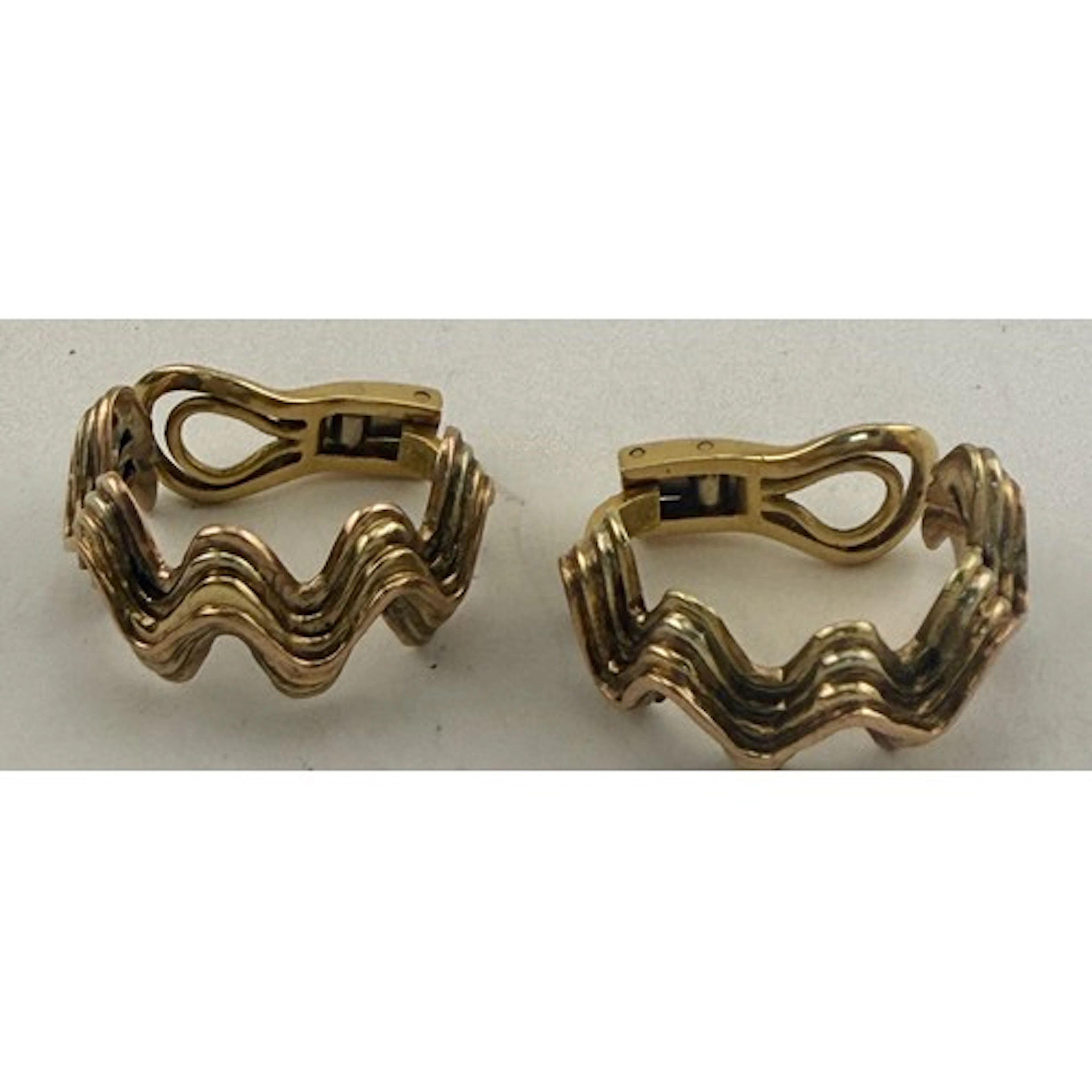 A pair of clip on yellow metal earrings. Weight 12.8gm. Mark...