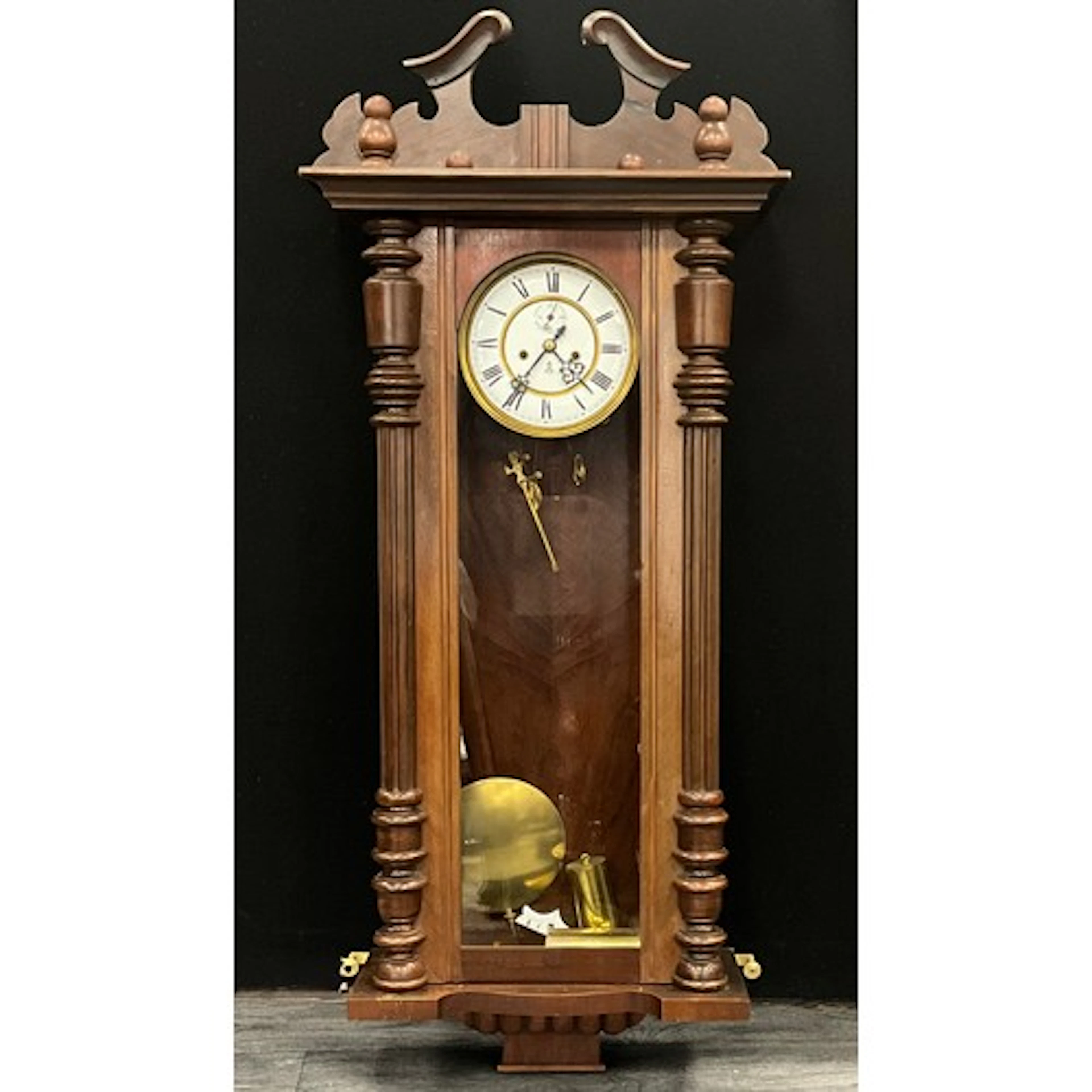 A 19th century walnut Vienna regulator wall clock, white ena...