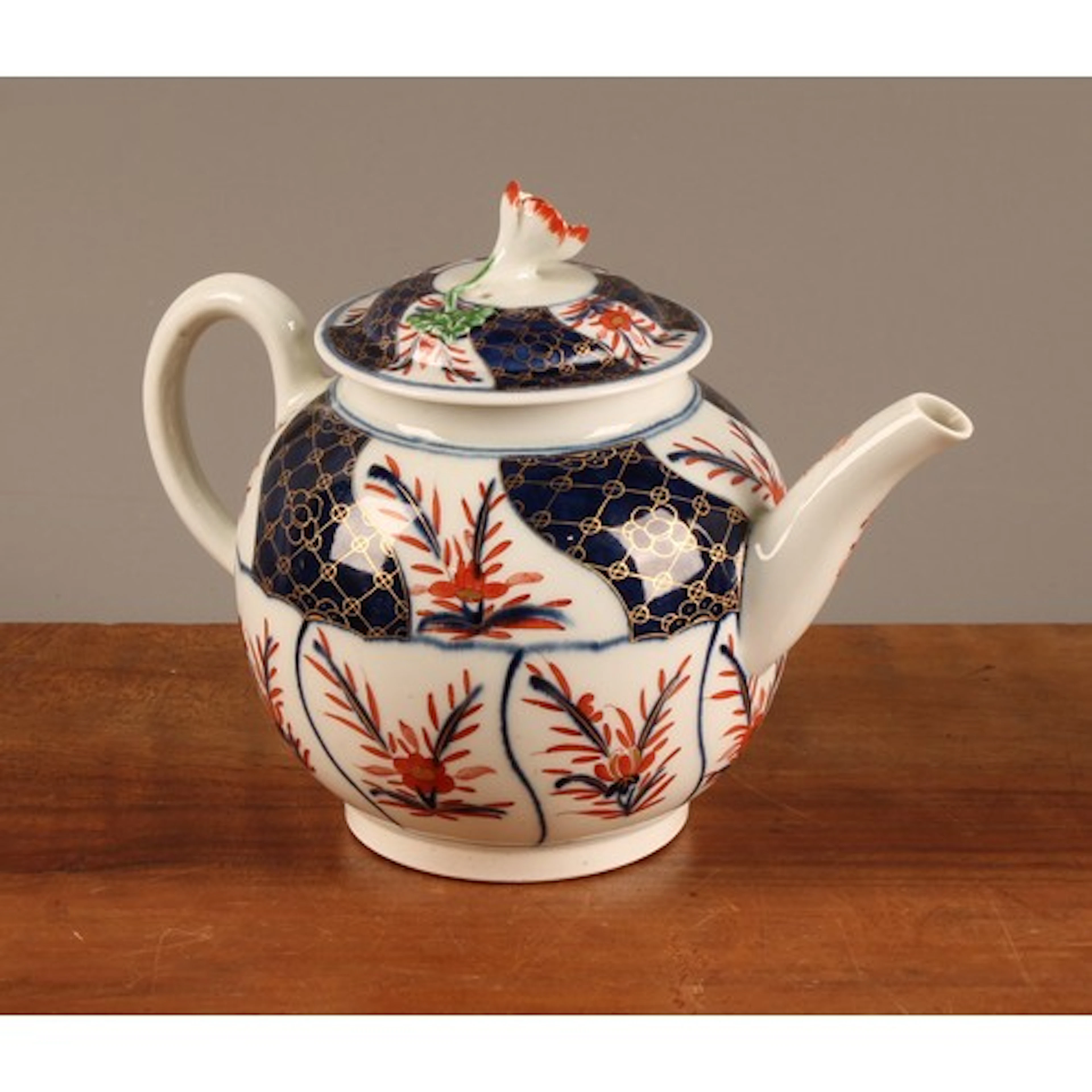 A Worcester globular teapot and cover, decorated in the Imar...
