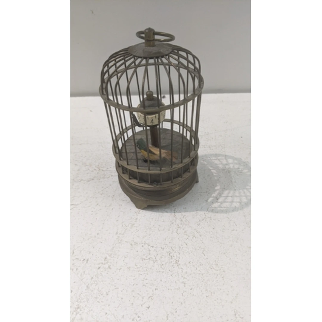 A vintage novelty brass bird cage automaton table clock Loca...