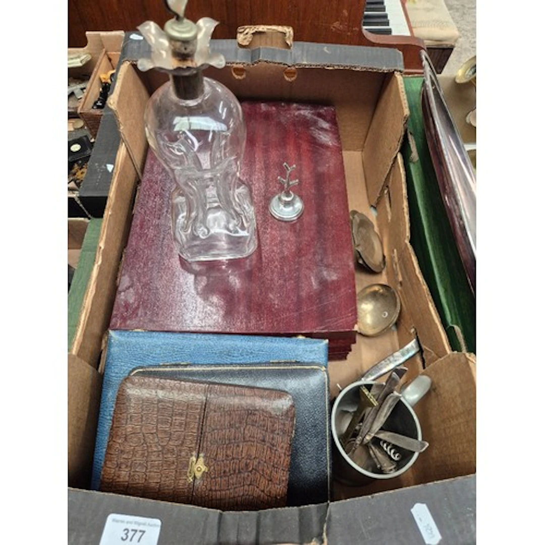 A box of metal ware to include canteen of cutlery, various c...