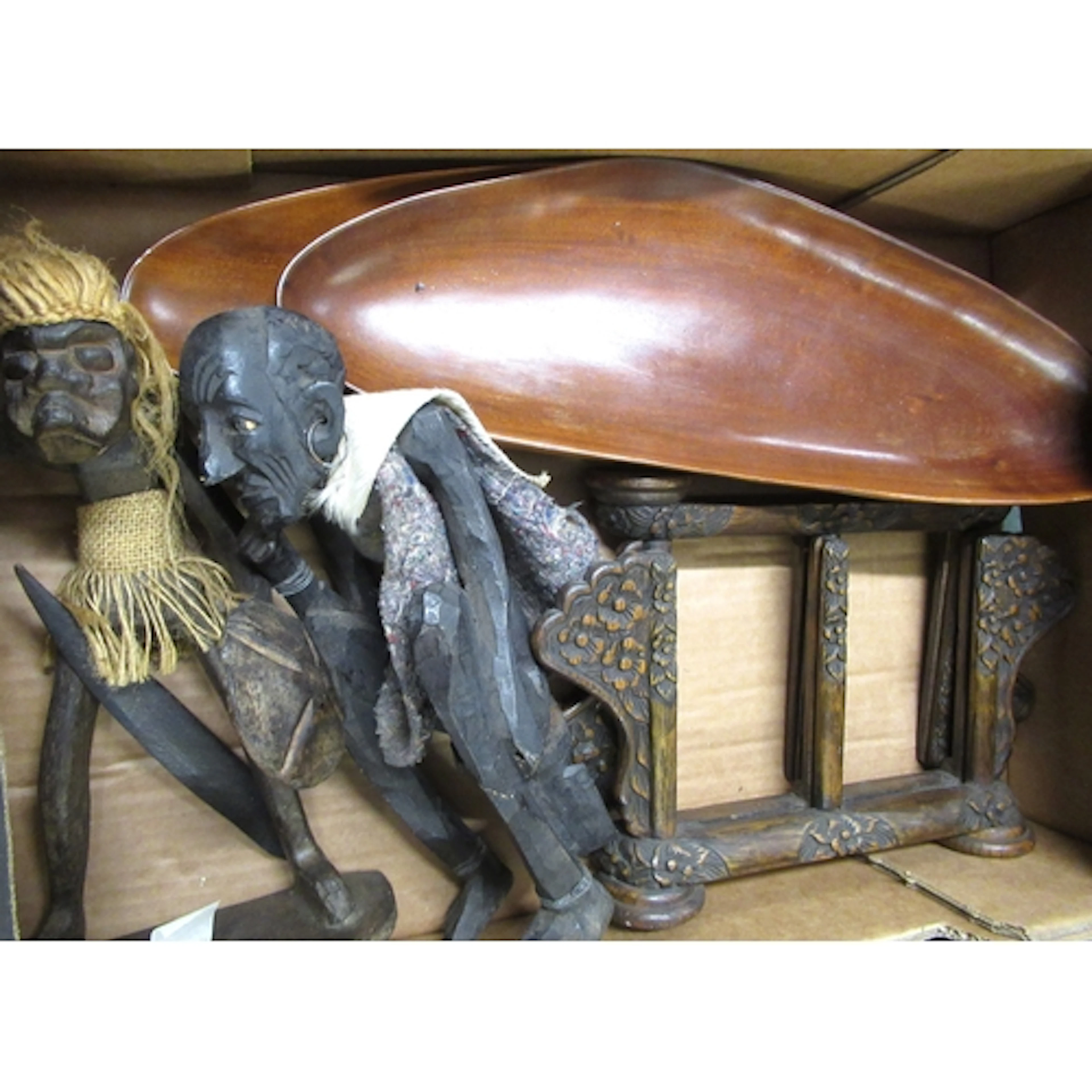 Two African carved figures, two bowls, and two stands