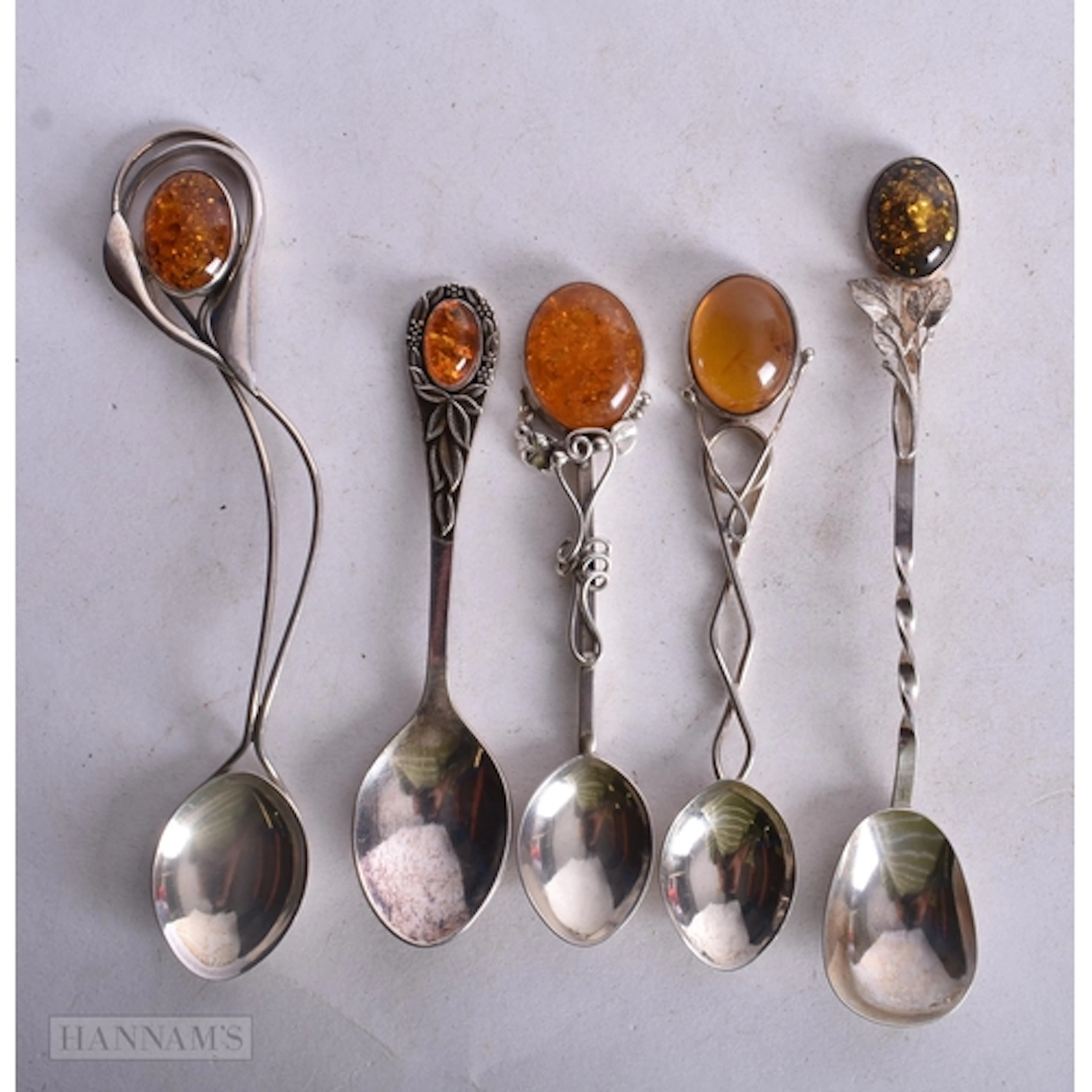SILVER AND AMBER SPOONS. 64 grams. (qty)