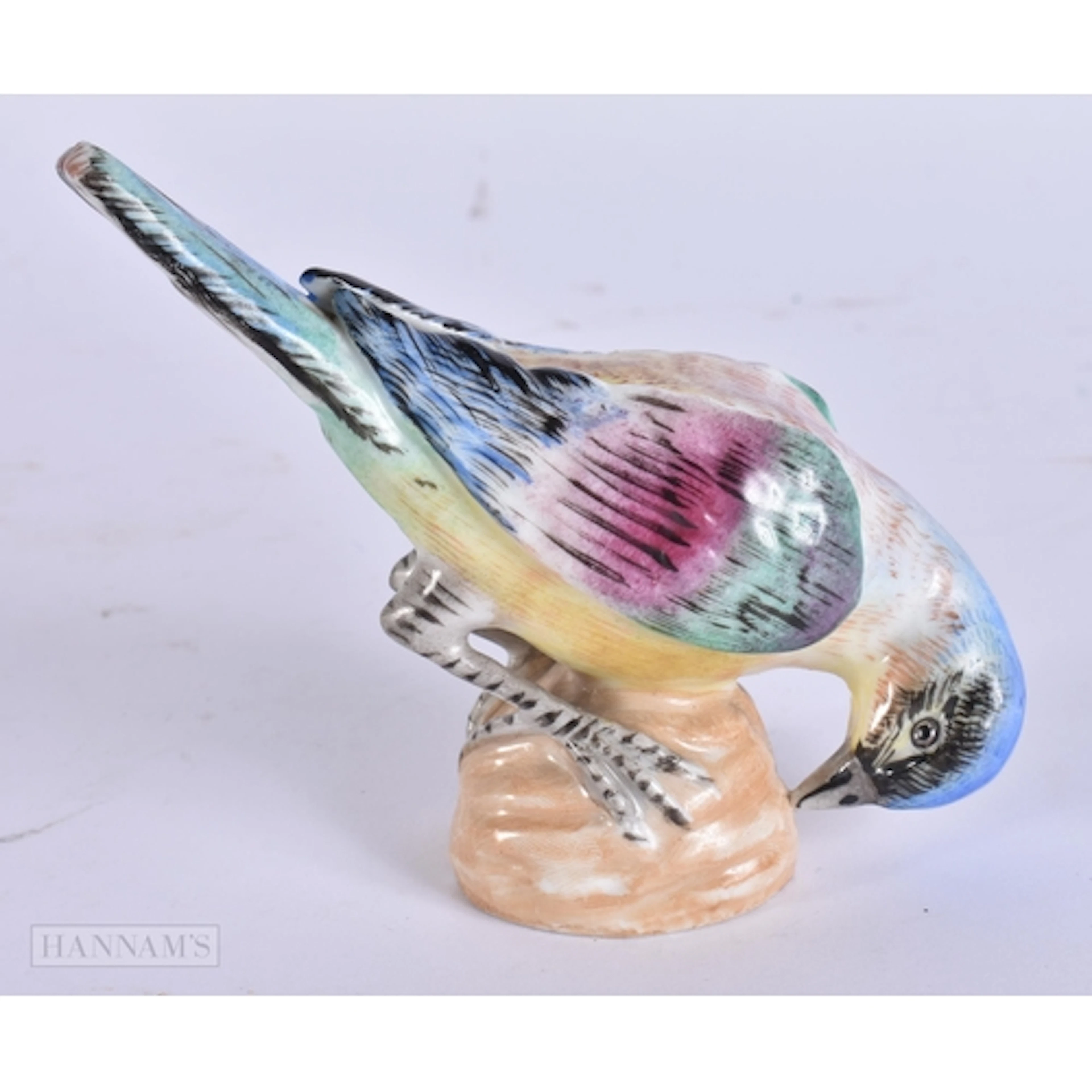 AN ANTIQUE GERMAN PORCELAIN FIGURE OF A BIRD possibly Meisse...