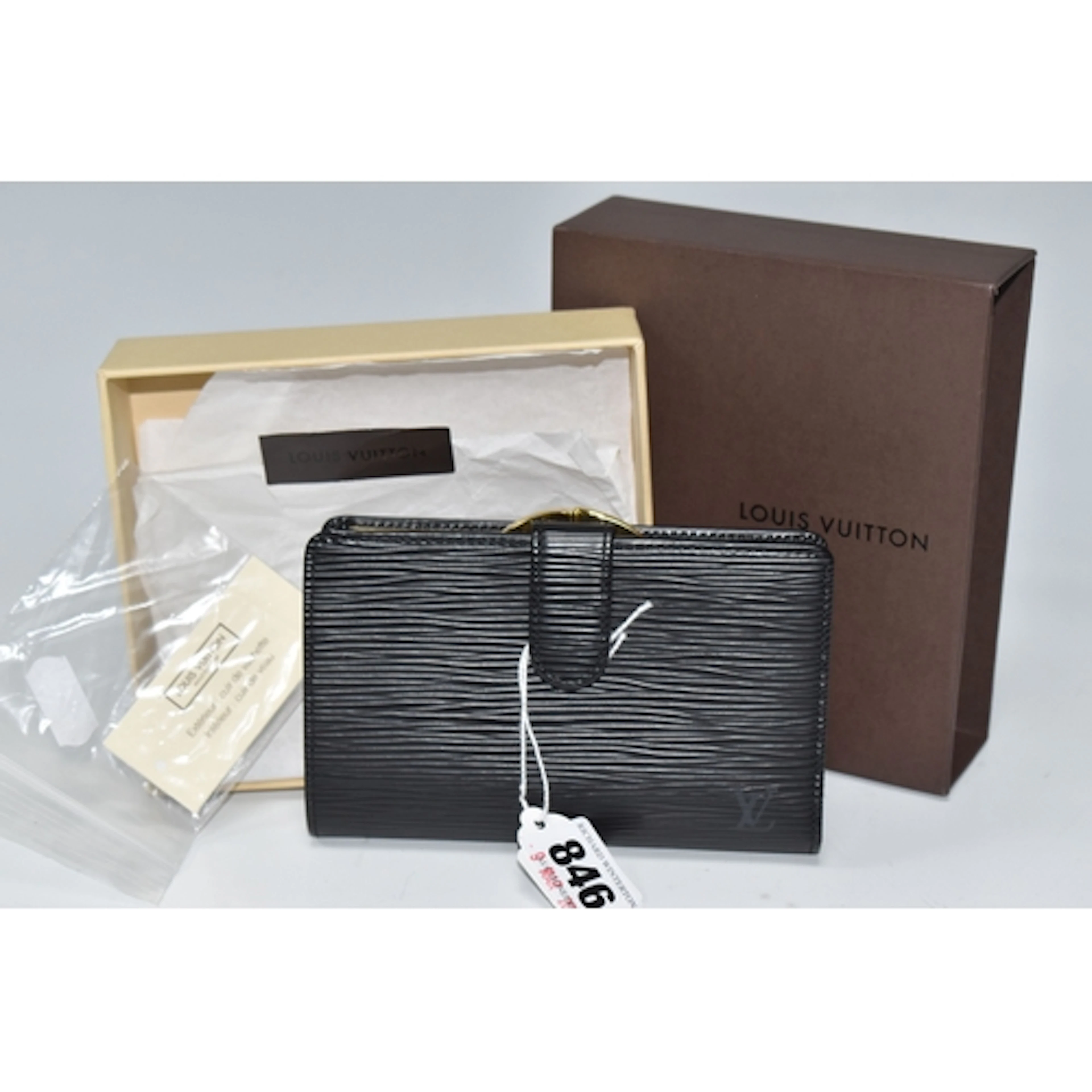 A BOXED LOUIS VUITTON M63242 LADIES BI FOLD WALLET IN BLACK ...