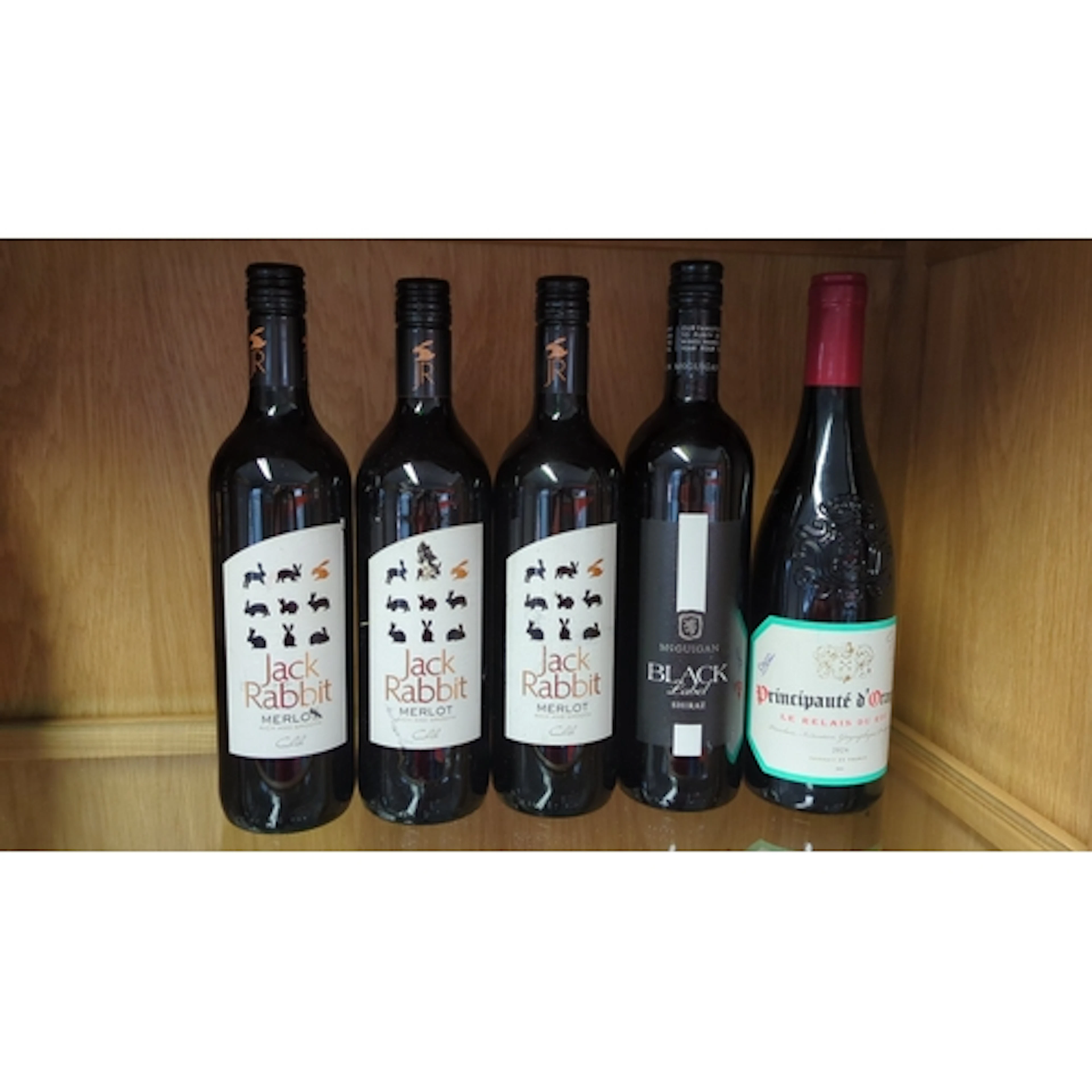 A group of five red wine bottles comprising three Jack Rabbi...
