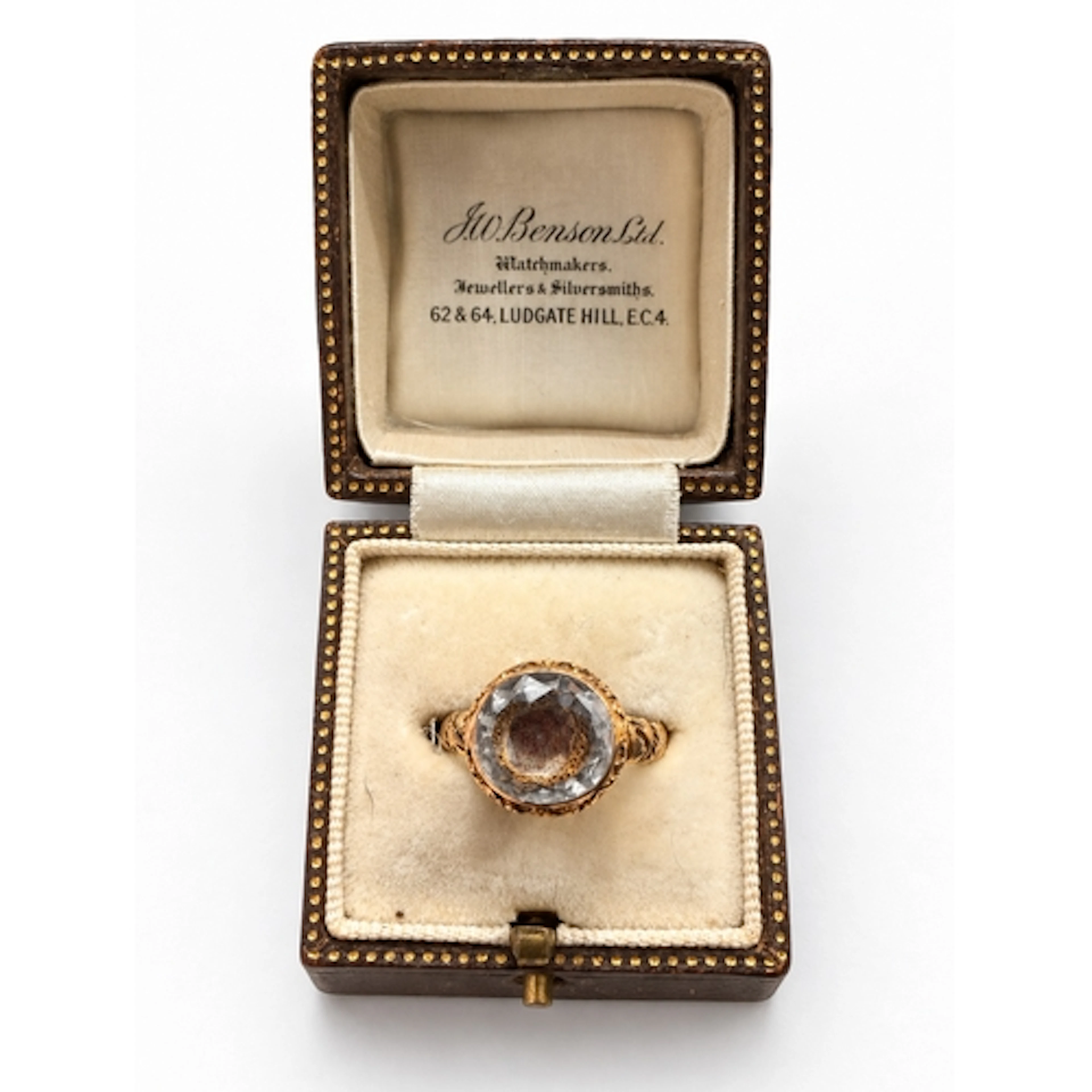 A rare high-carat gold ring set with a large domed rock crys...