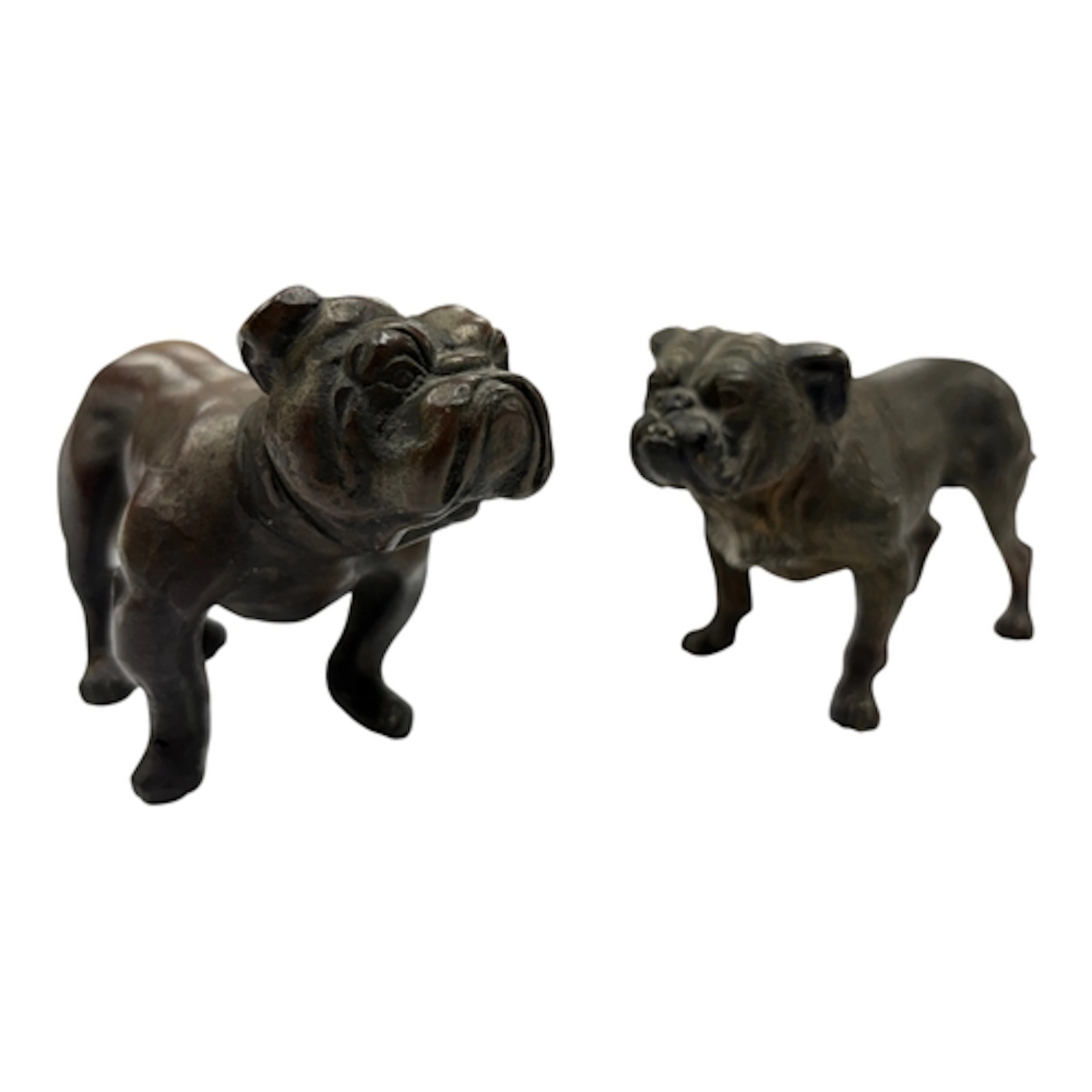 Two Austrian style bronze bulldogs, one with partial cold pa...