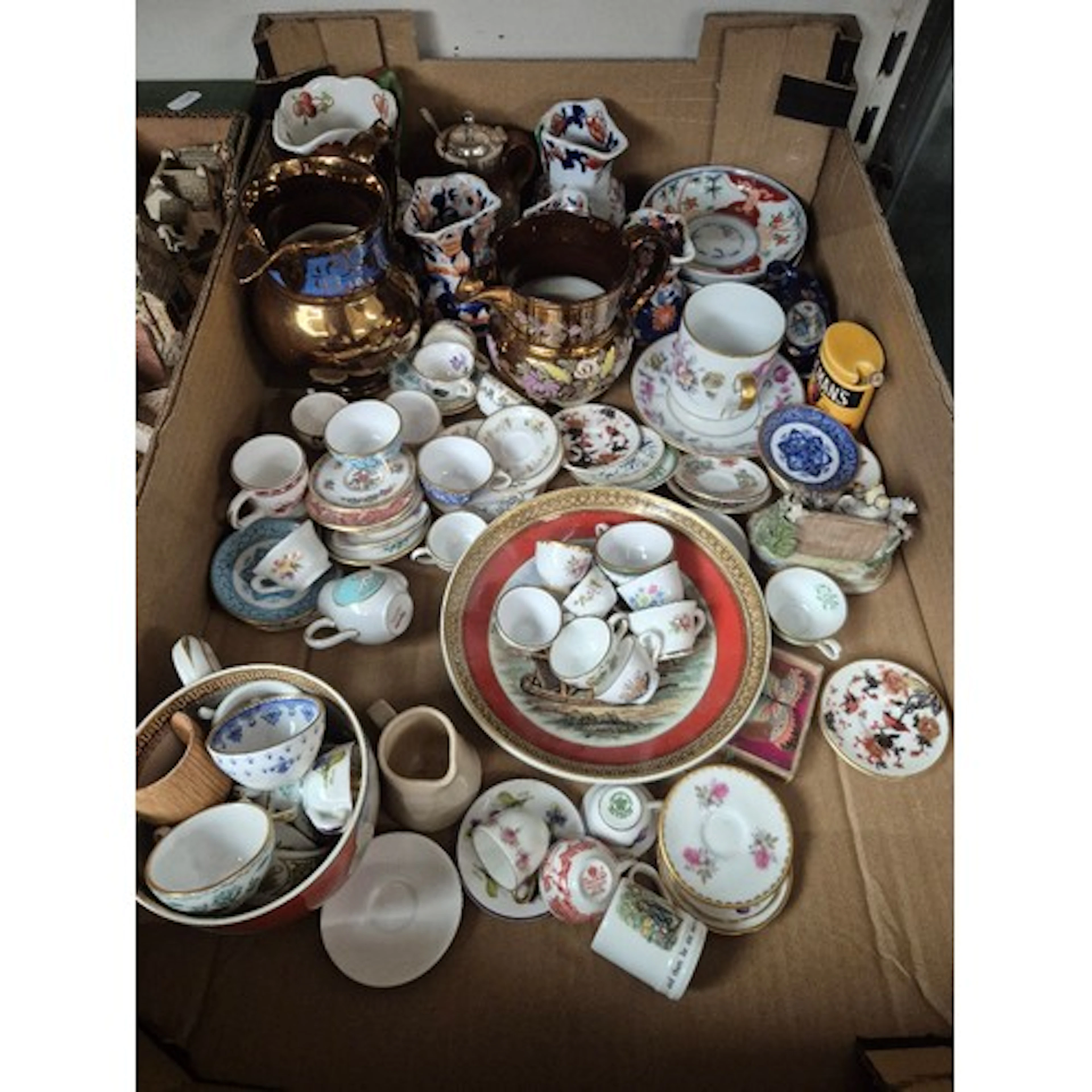 A box containing mainly miniature cups and saucers etc, incl...