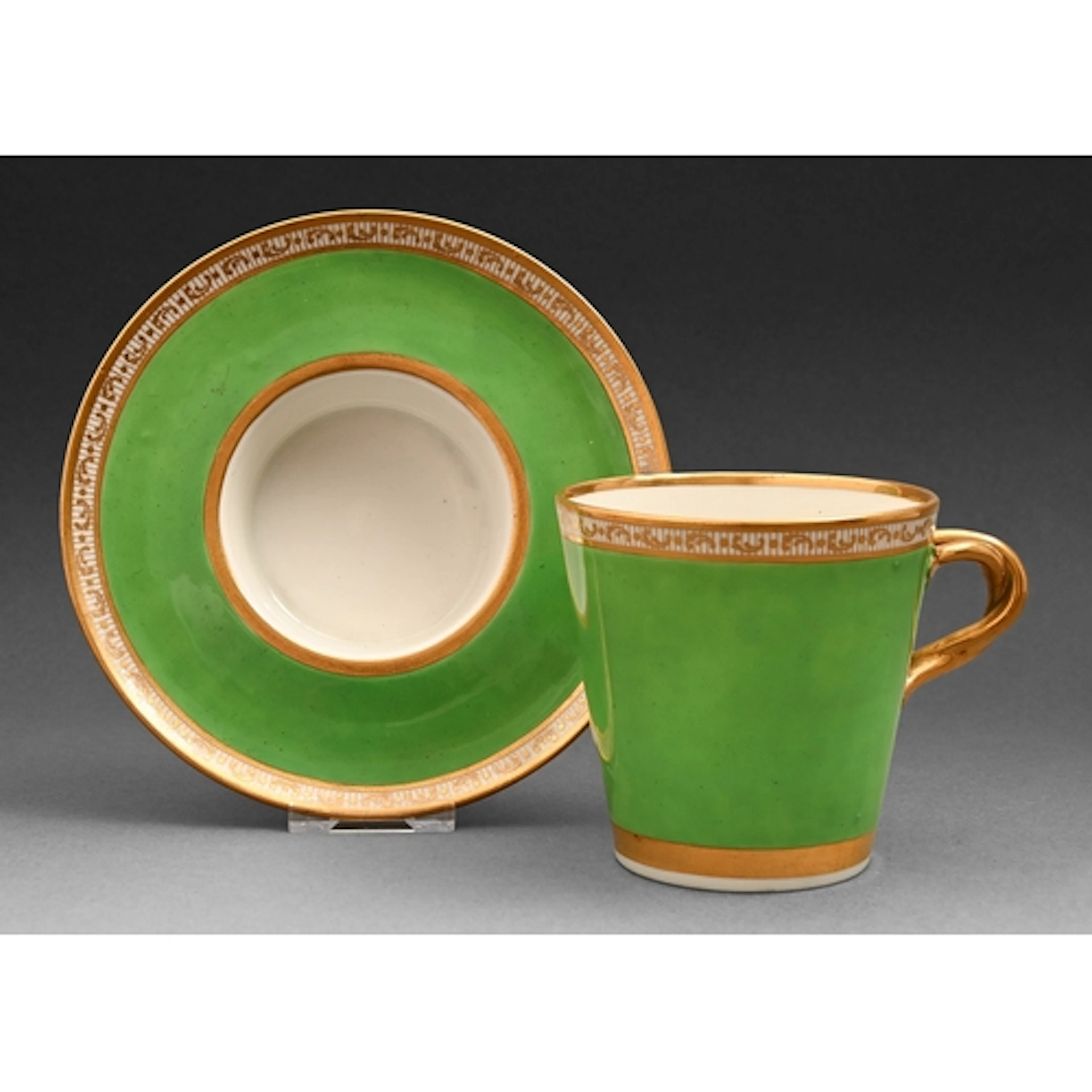 A Derby trembleuse cup and stand, 1795-1800, the vivid green...