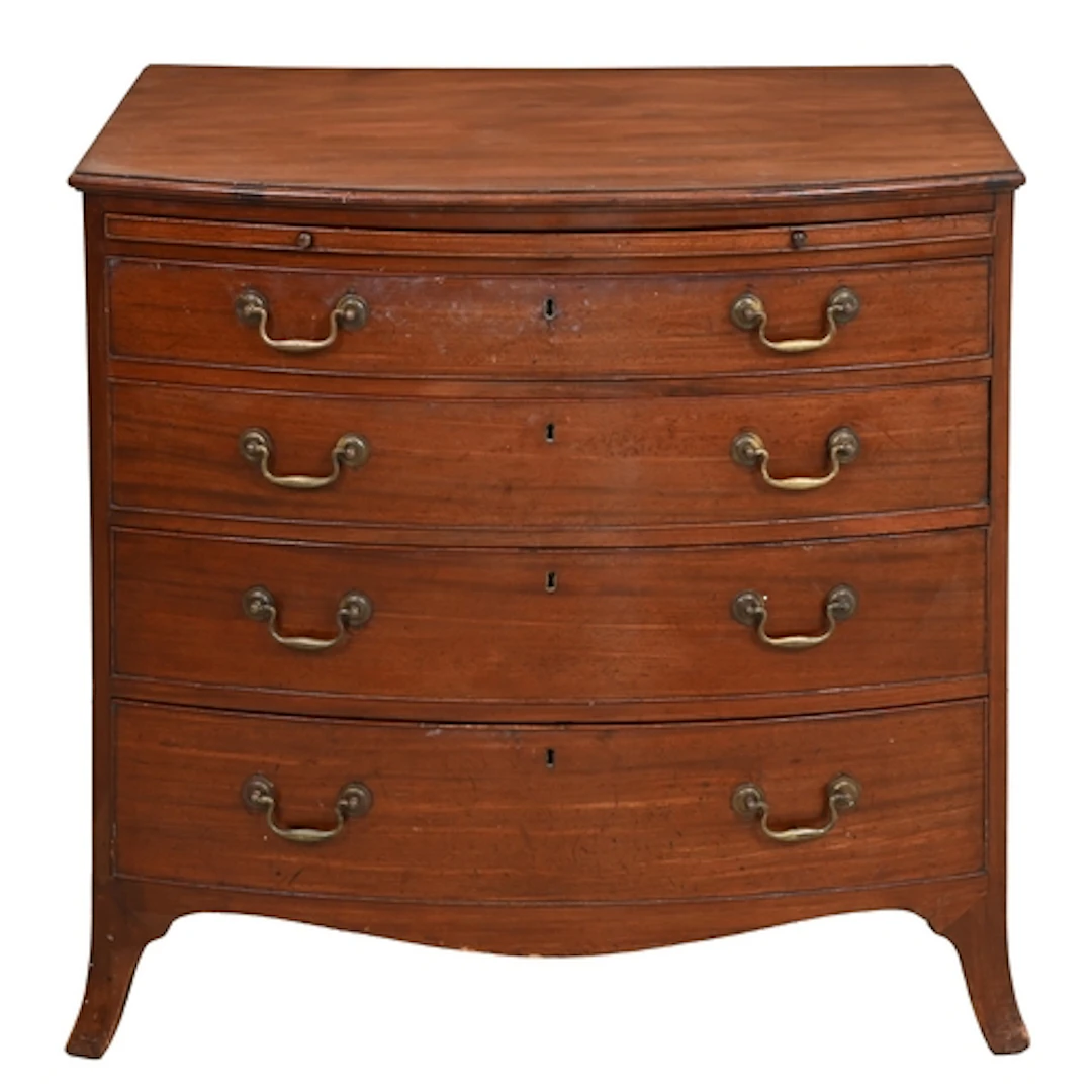 A George III bow fronted mahogany chest of drawers, with bru...