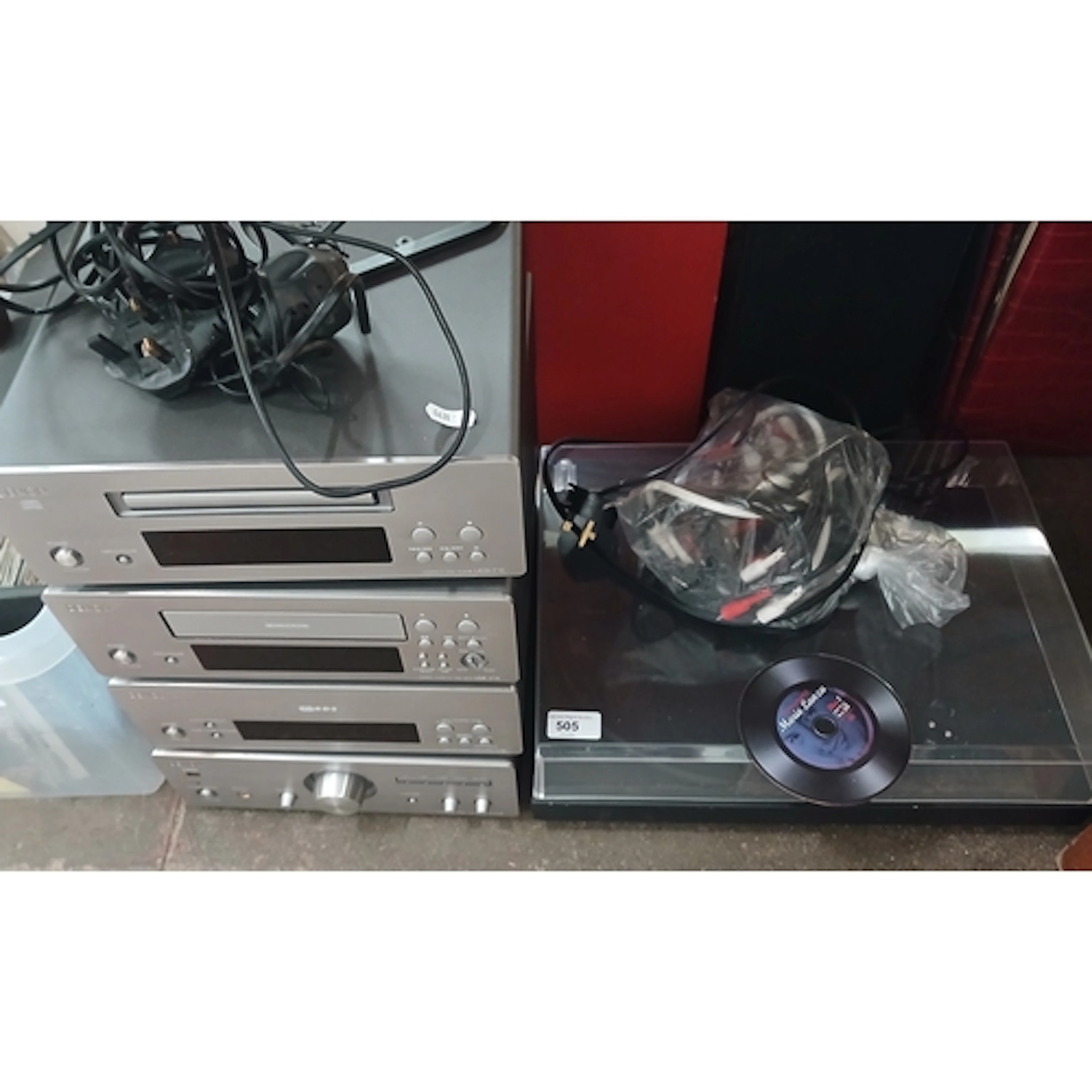 A Denon hifi system and a Project turntable.
