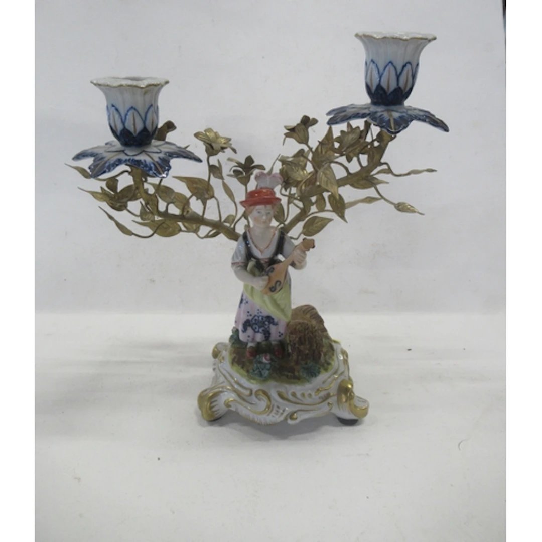 A continental porcelain and metal candelabrum, height 9.25in...