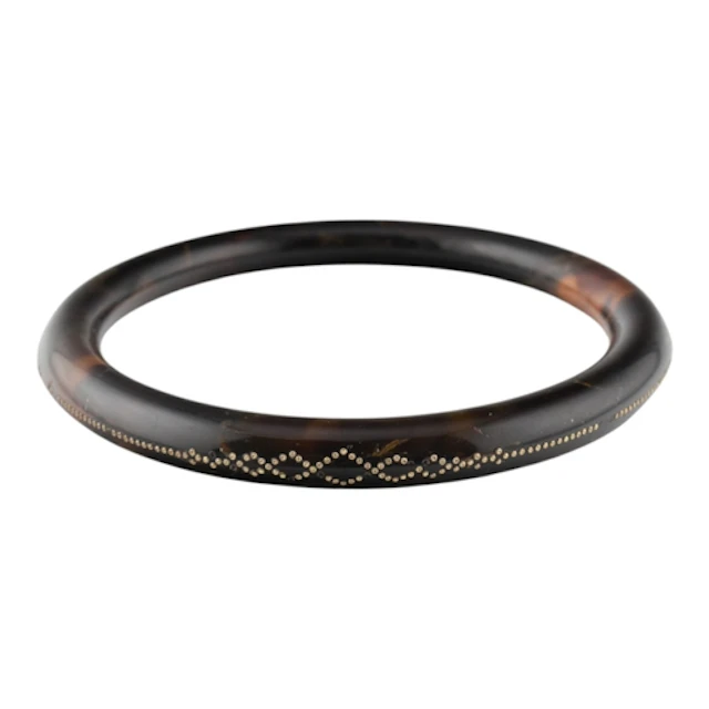 1920s tortoiseshell piqué work bangle. The bangle with geome...