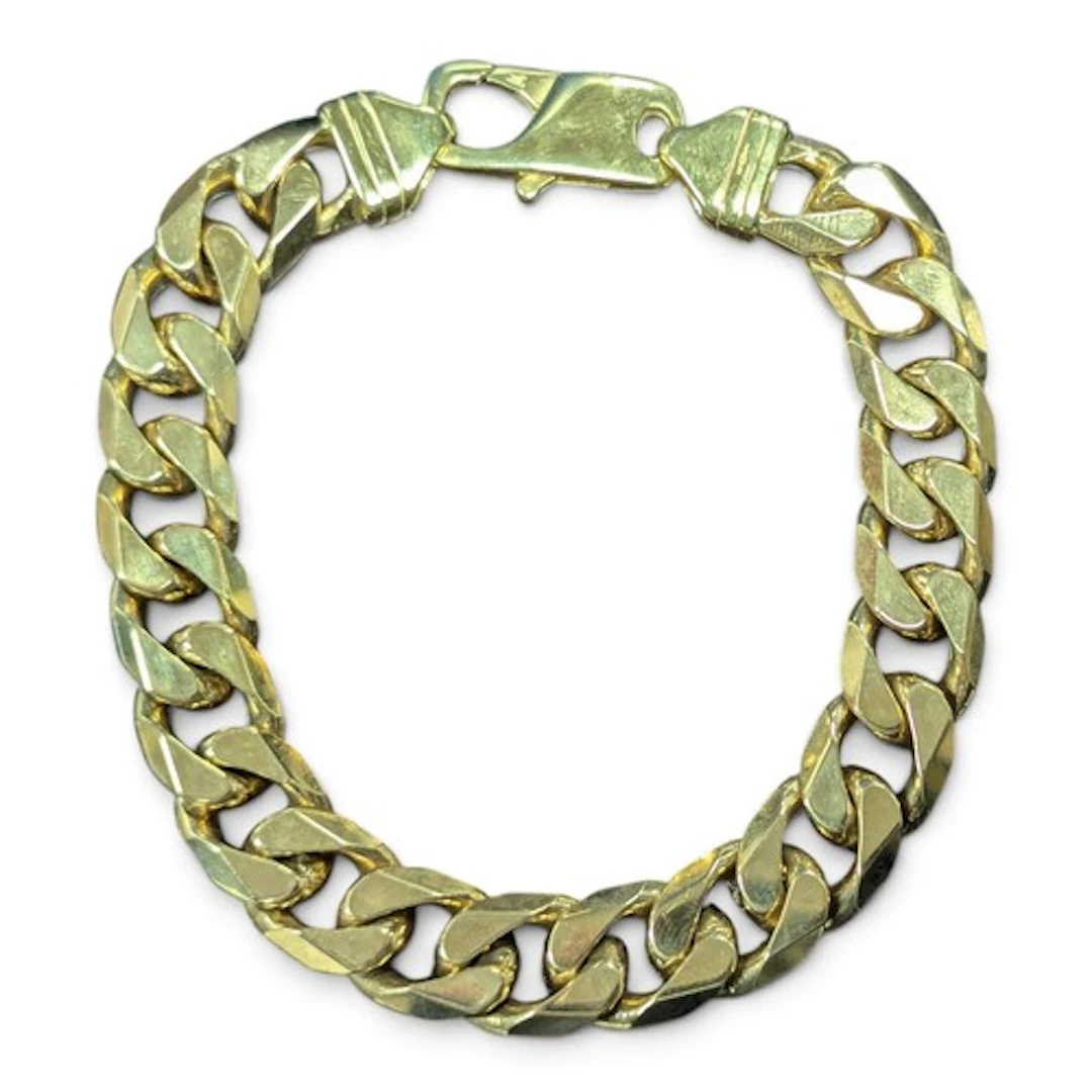 A 9ct gold heavy weight curb link bracelet, Birmingham impor...