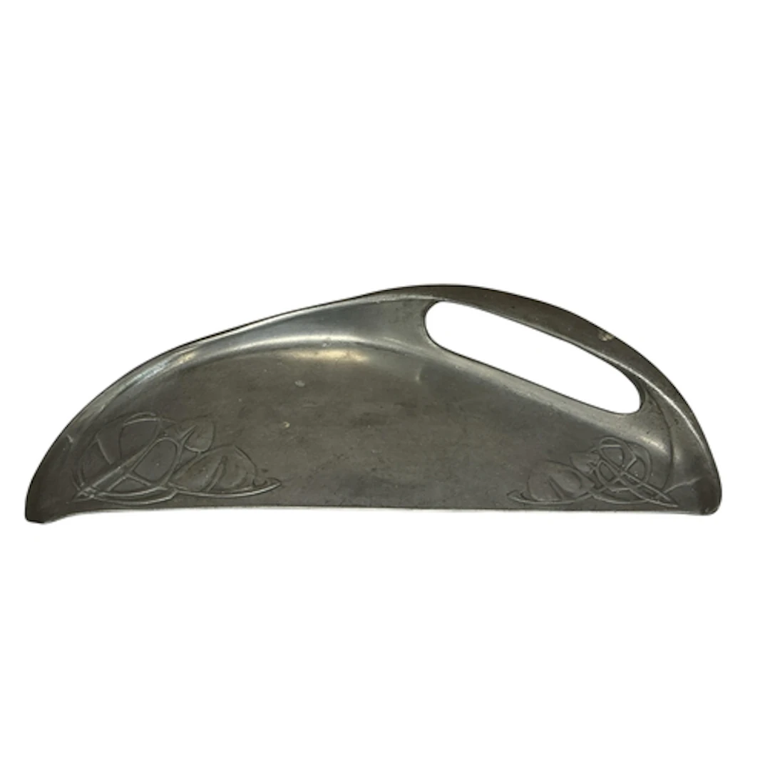 Archibald Knox for Liberty, a pewter crumb scoop, numbered 0...