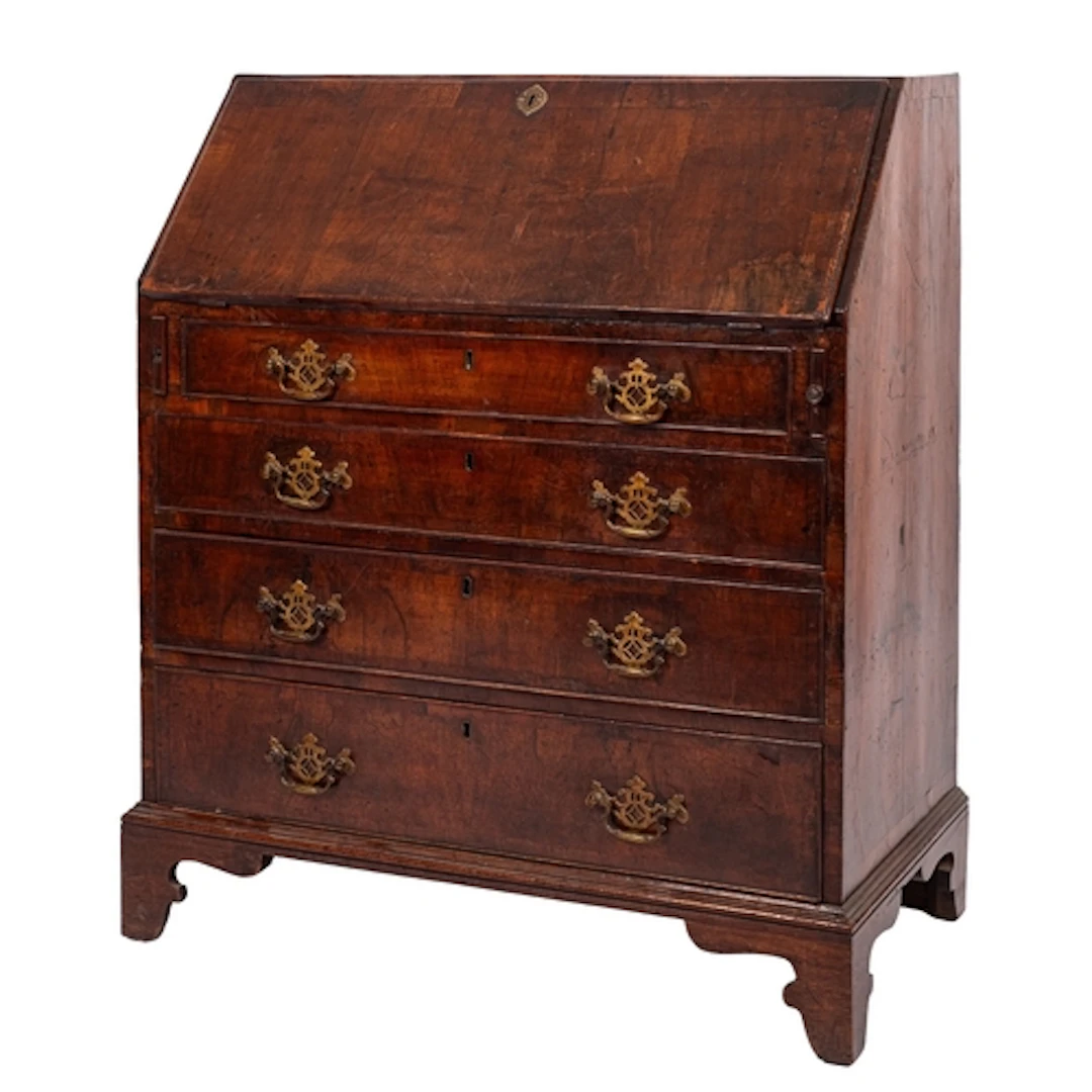 A late George II or George III walnut and banded bureau, cir...