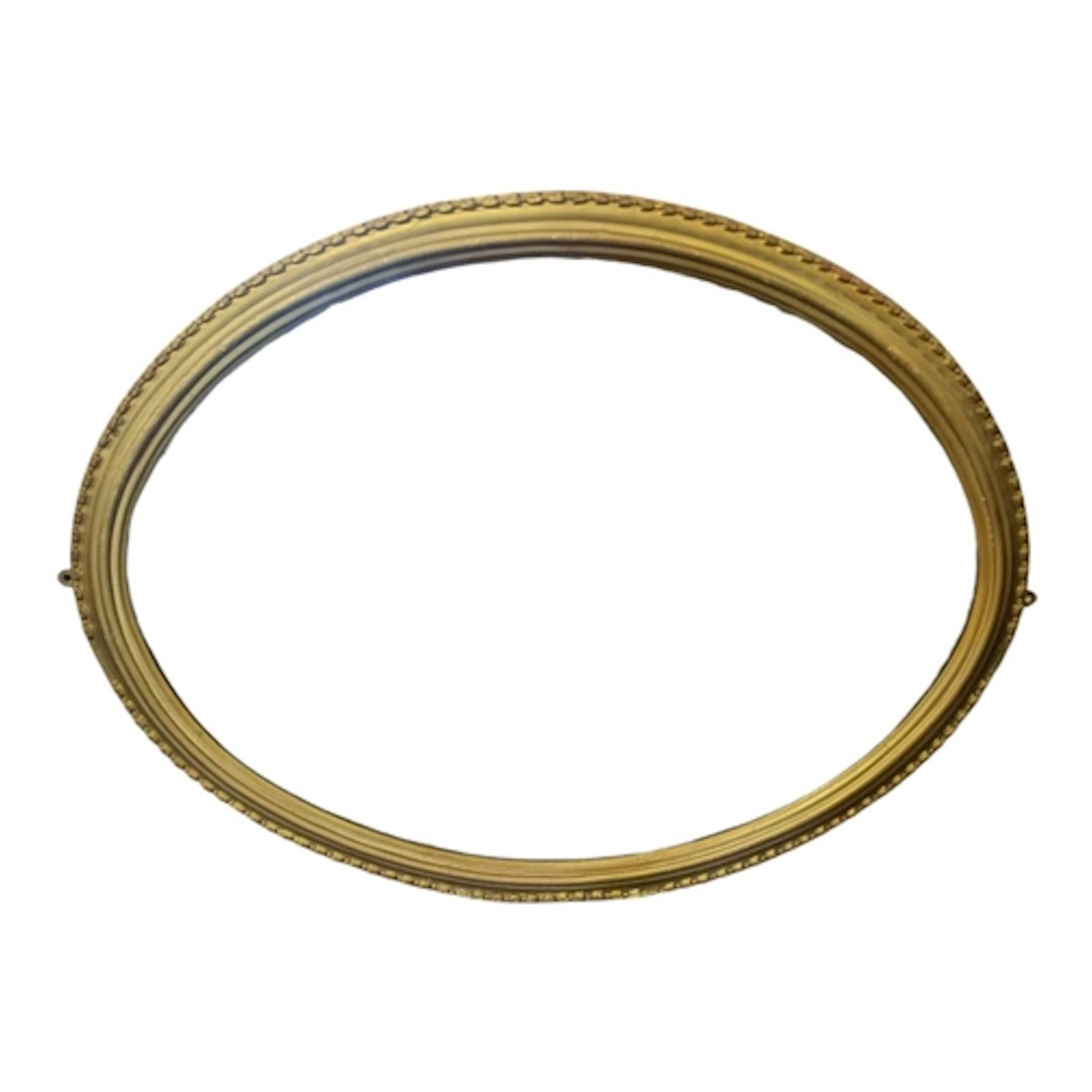 A vintage mid century giltwood oval wall hanging mirror. Gil...