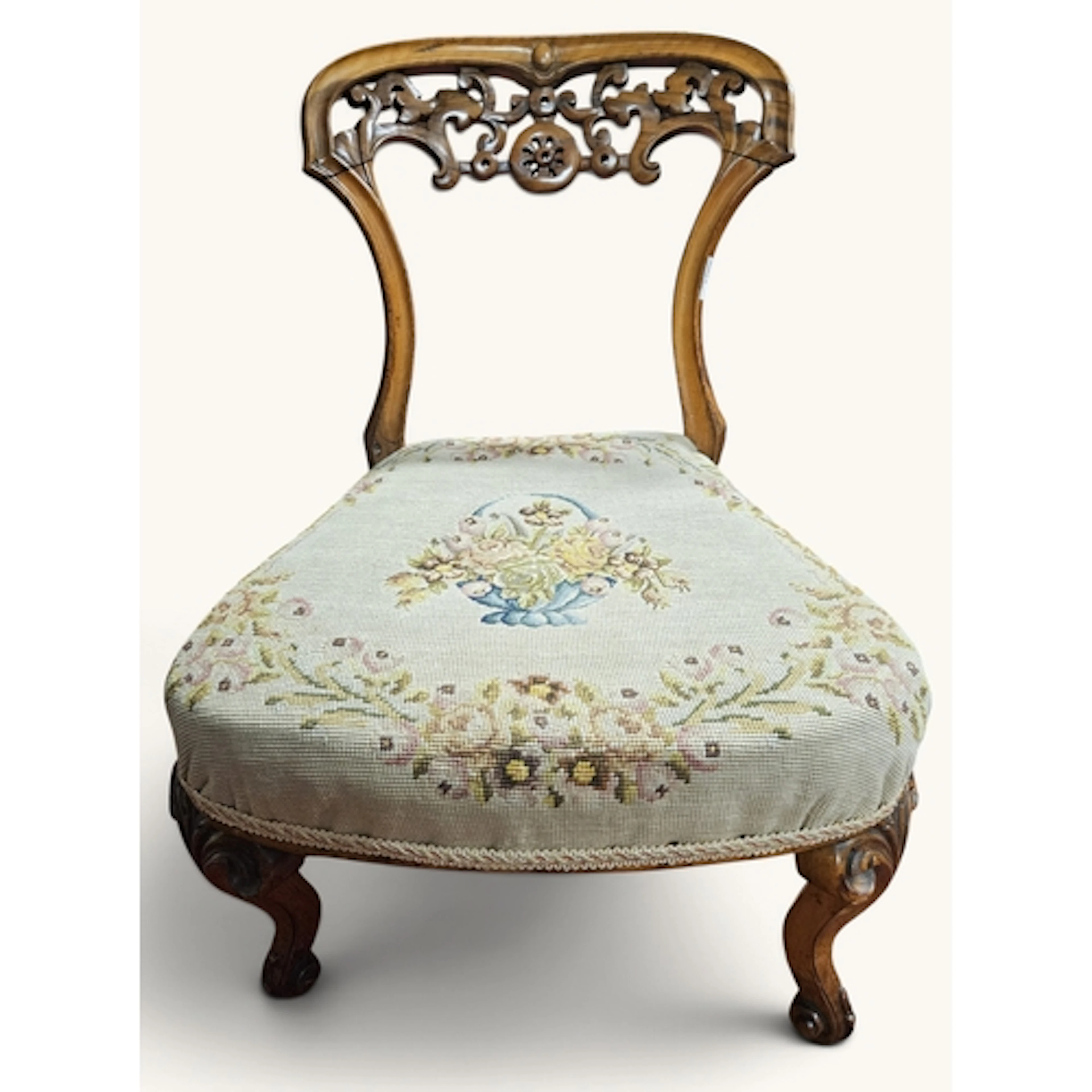 A 19th Century tapestry upholstered Nursing Chair with carve...