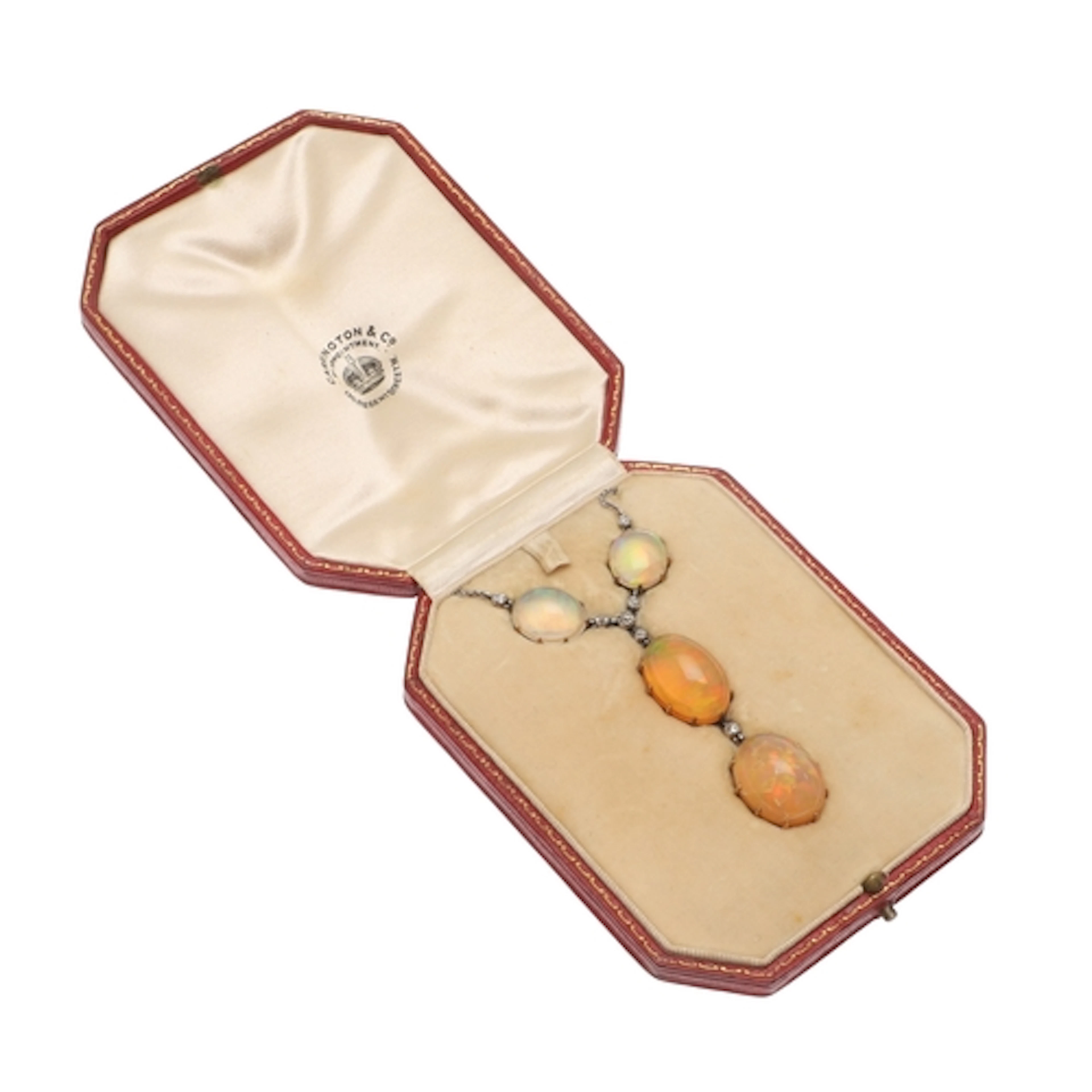 AN OPAL AND DIAMOND PENDANT. formed with four oval-shaped ca...